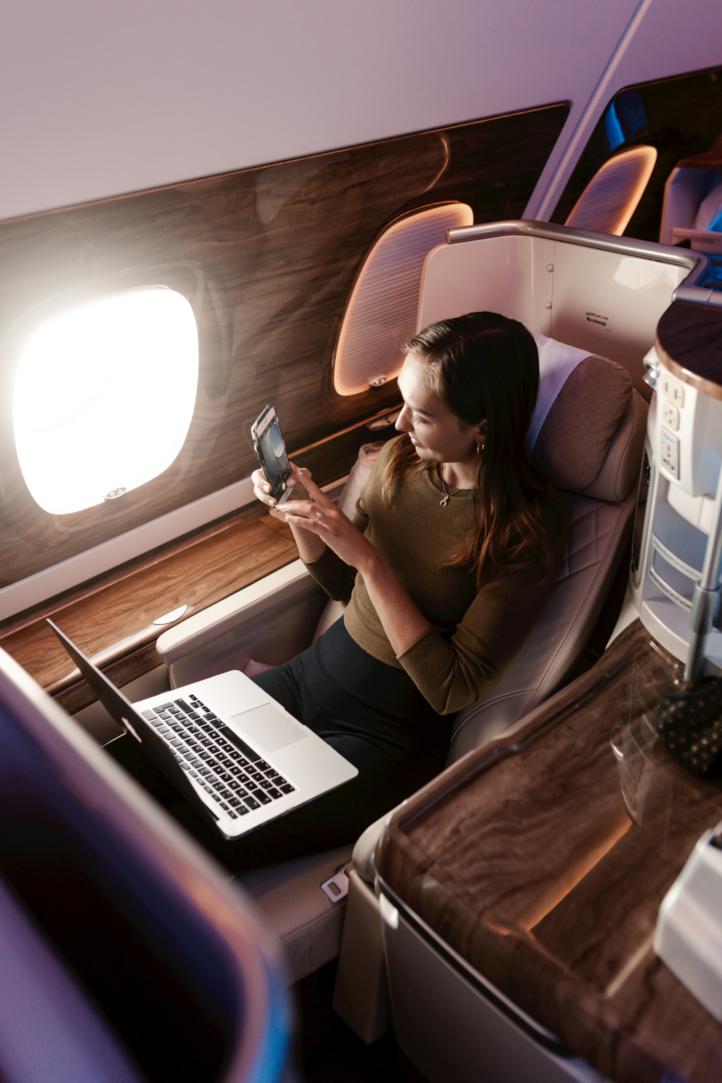 A woman sitting in a business class seat | Source: Unsplash