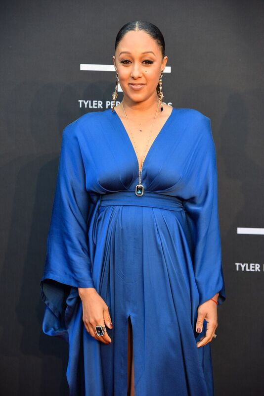 Tamera Mowry smiles for a picture at the red carpet event of the Tyler Perry Studios Opening Gala | Source: Getty Images/GlobalImagesUkraine