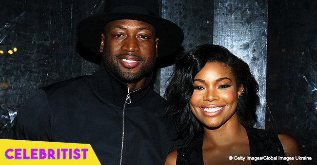Gabrielle Union stuns in a neon cut-out swimsuit while on vacation with husband Dwyane Wade