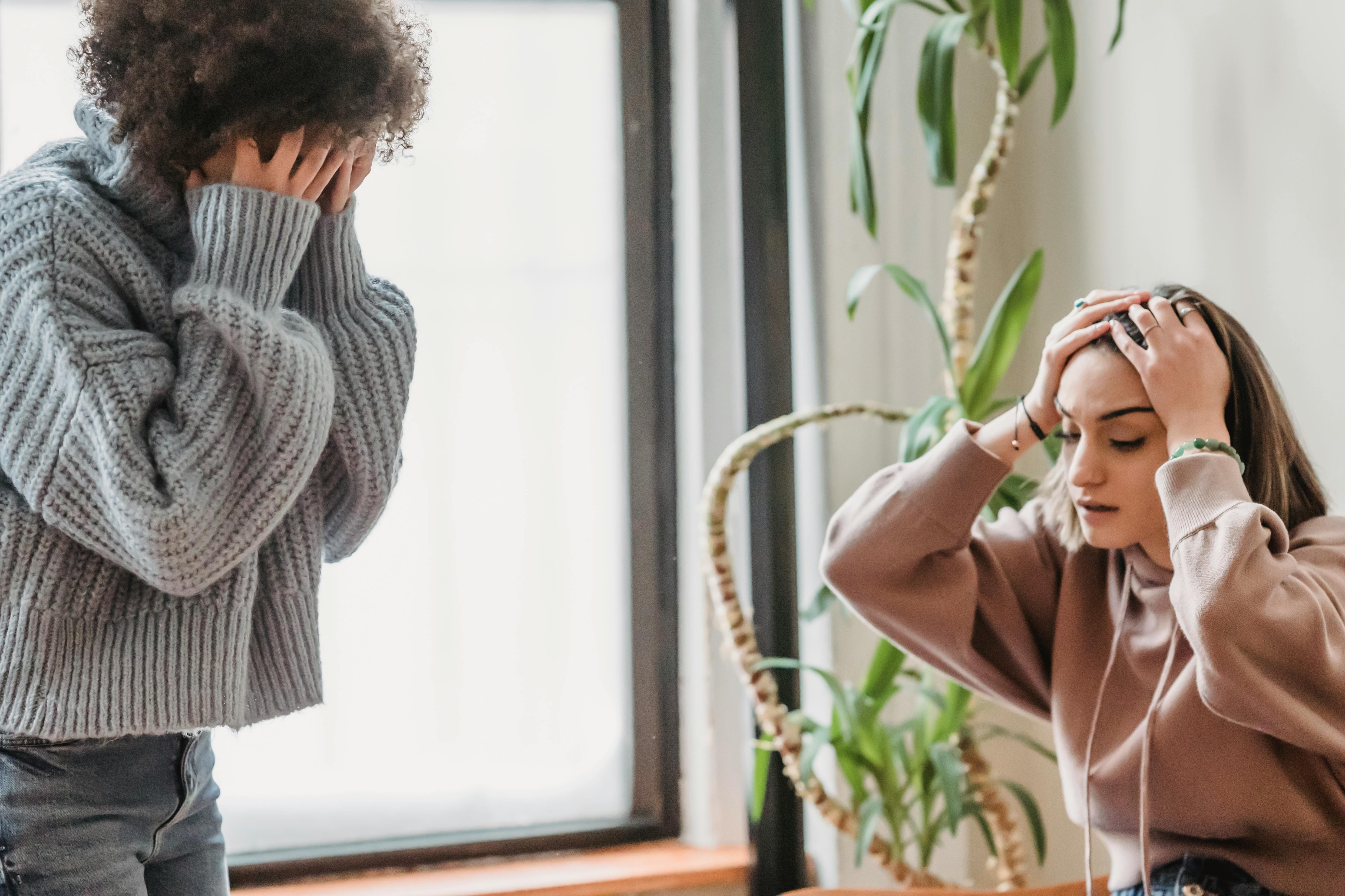 An unrecognizable woman having argument with an upset female | Source: Pexels