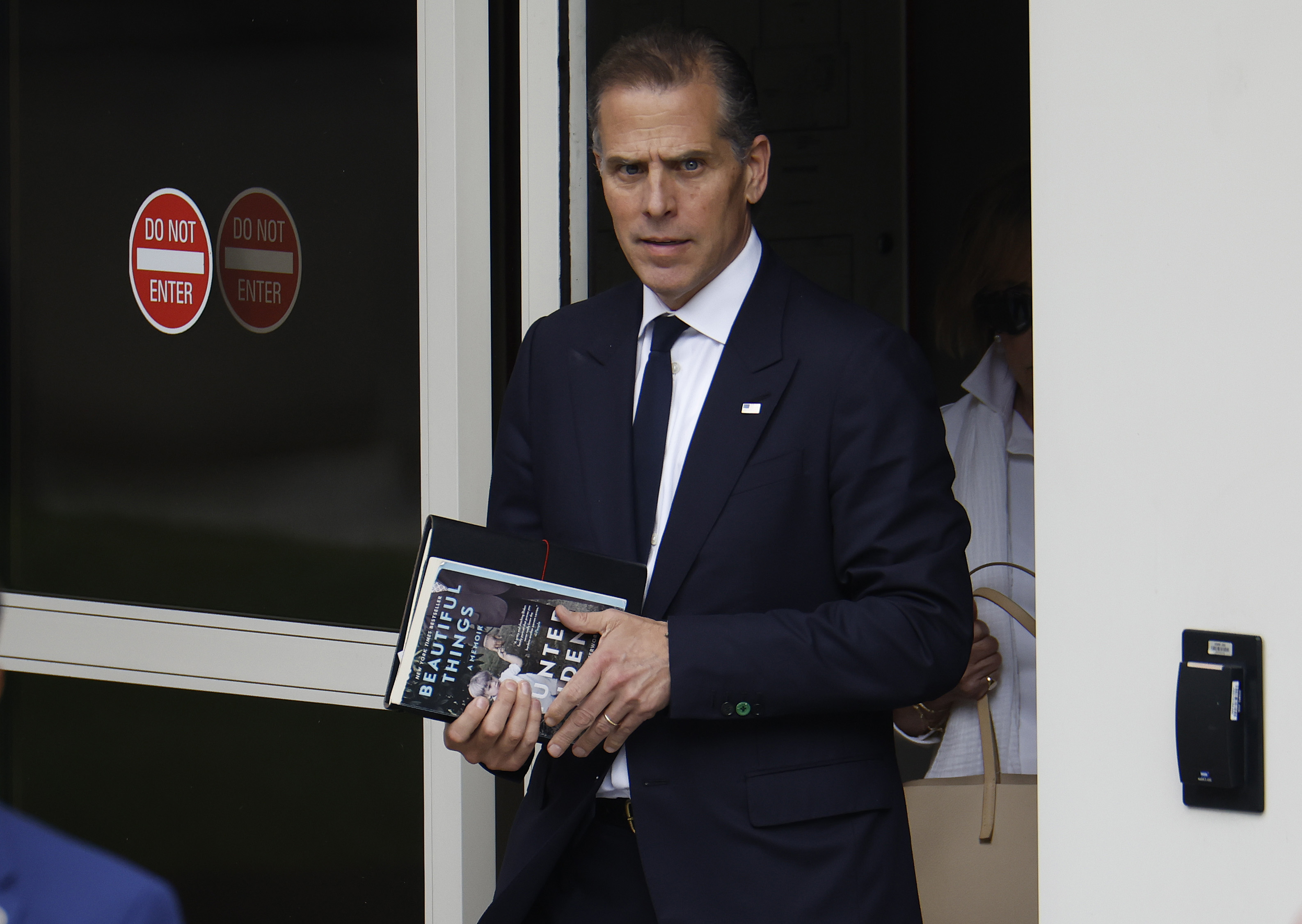 Hunter Biden with his book as he leaves the J. Caleb Boggs Federal Building on June 6, 2024, in Wilmington, Delaware. | Source: Getty Images