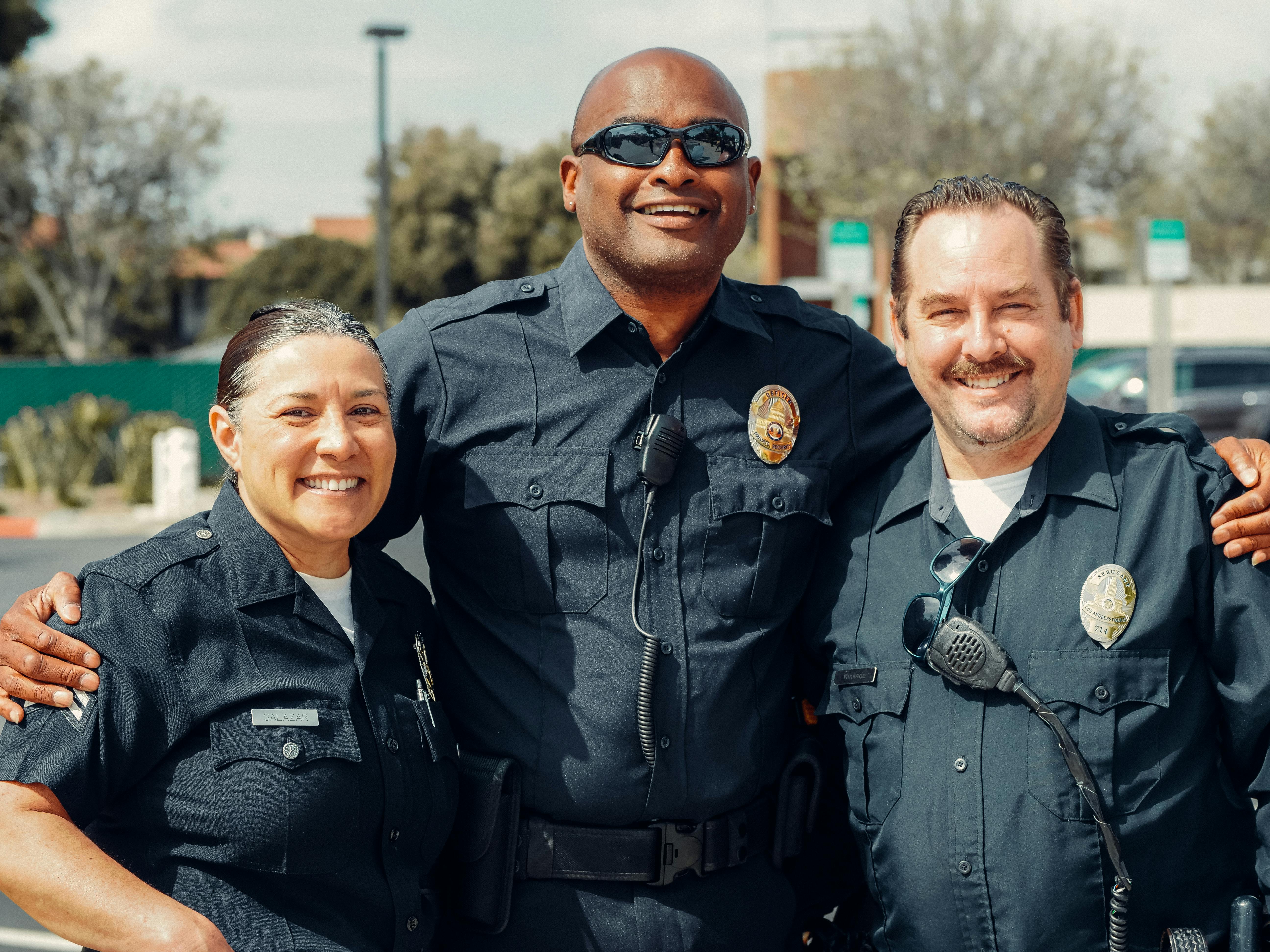 Three police officers posing together | Source: Pexels