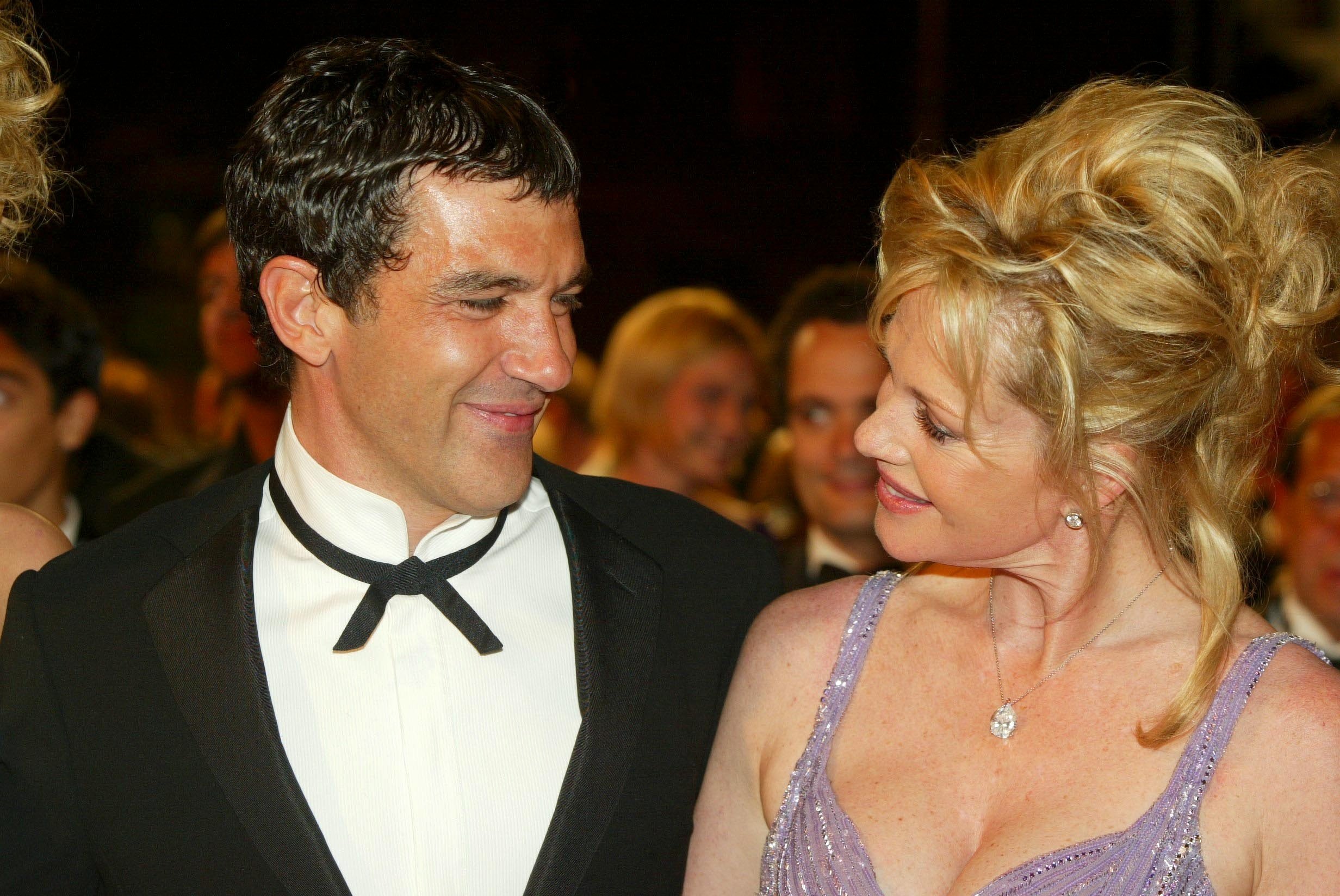Antonio Banderas and Melanie Griffith during the 55th Cannes film festival: Stairs of "Femme Fatale" on May 25, 2002 in Cannes, France ┃Source: Getty Images