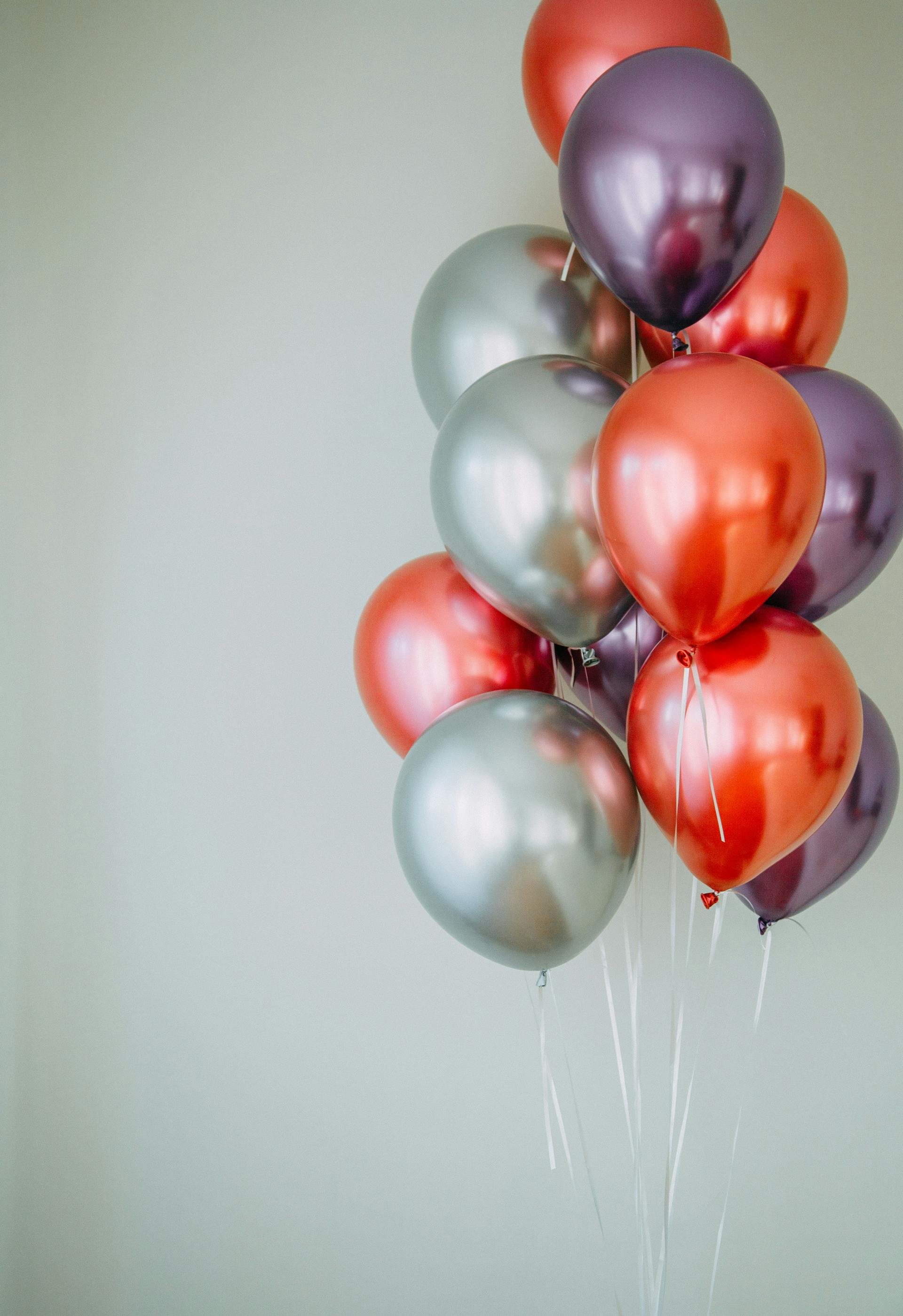 Floating shiny balloons | Source: Pexels