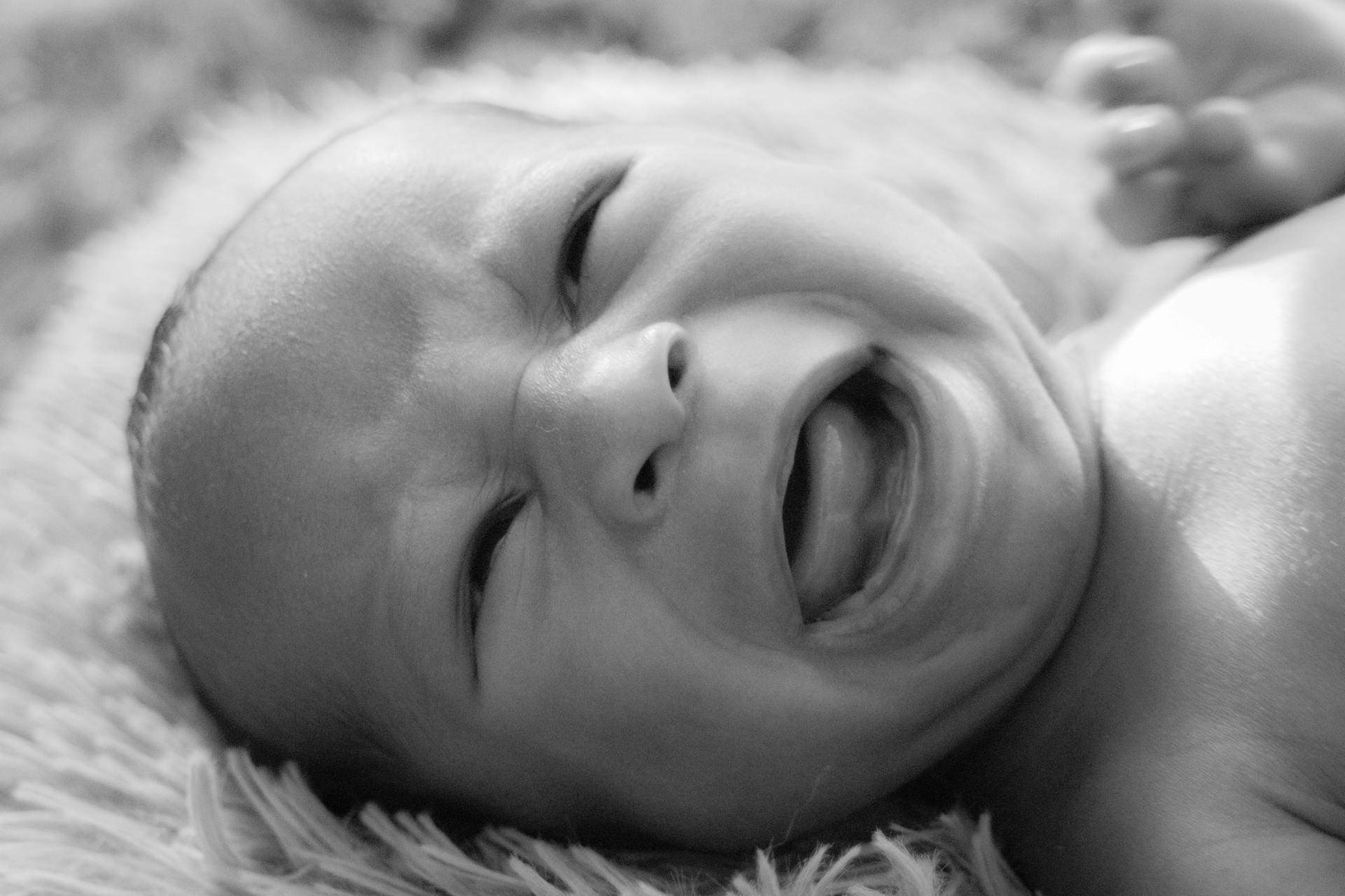 A grayscale photo of a baby crying | Source: Pexels