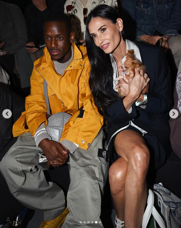 Michael Ward and Demi Moore are seated together at the Dior Homme show during Paris Fashion Week on June 21, 2024. | Source: Instagram/demimoore