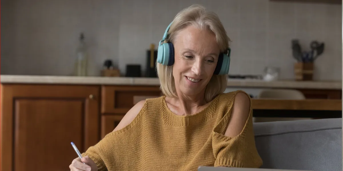 A woman listening to music while working on a hobby | Source: Shutterstock