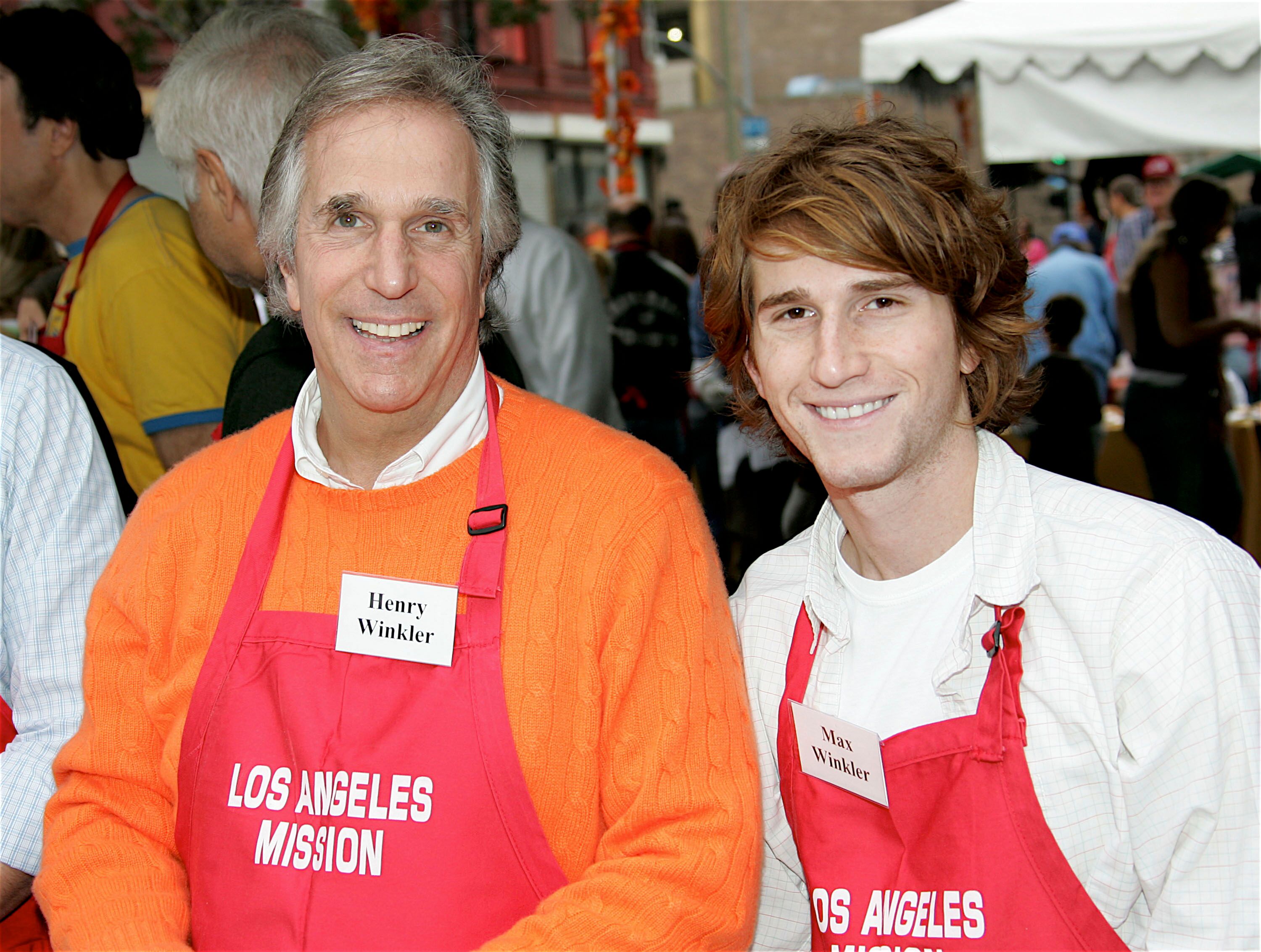 Henry Winkler and Max Winkler pose at the Los Angeles Mission Thanksgiving. | Source:Getty Images