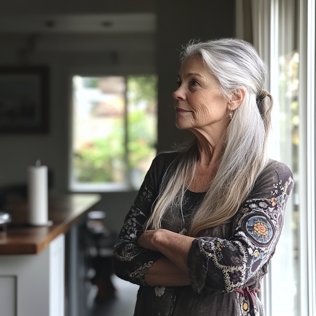 An older woman standing with her arms folded | Source: Midjourney