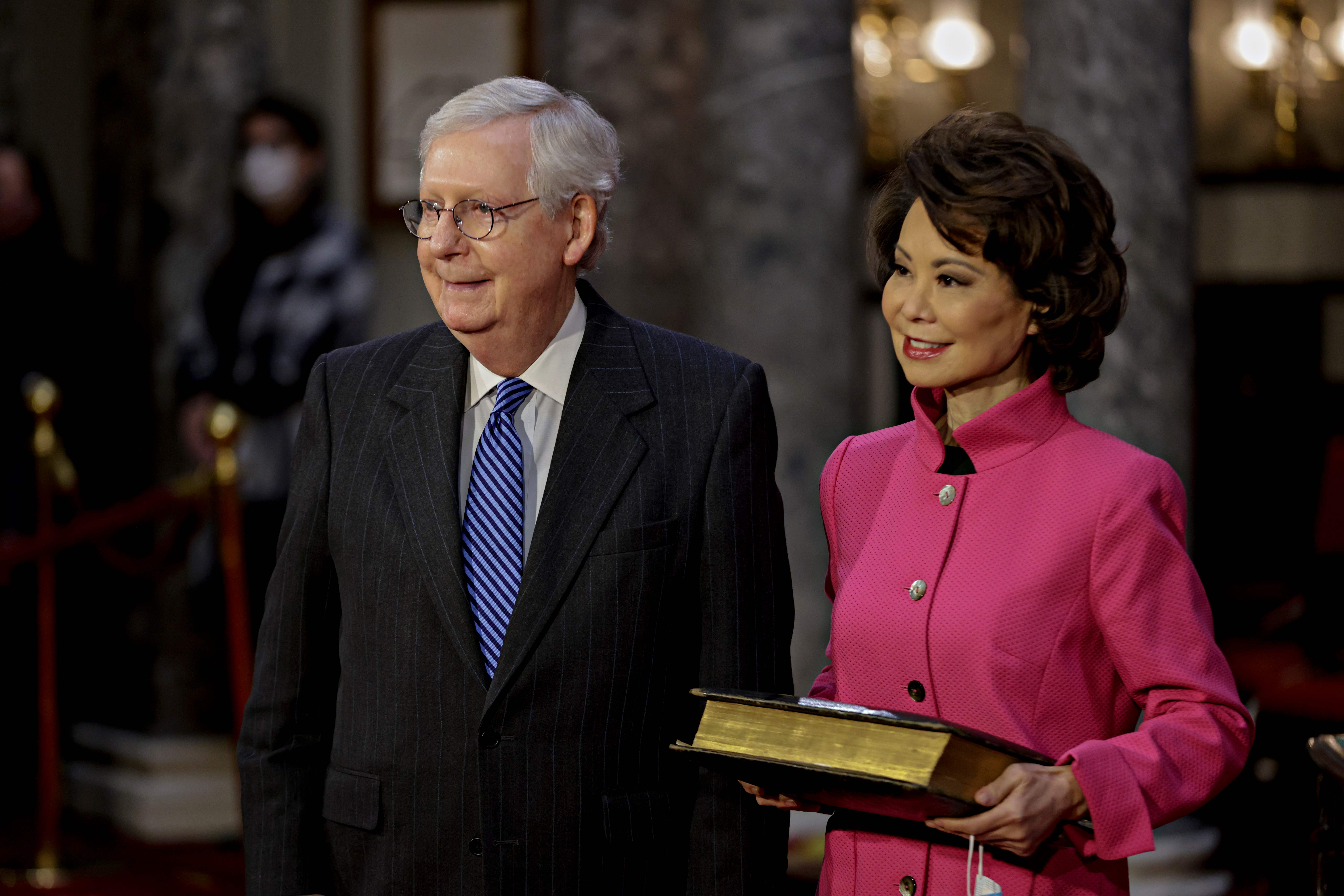 McConnell and his wife, Elaine Chao, are seen at the U.S. Capitol on January 3, 2021. Chao later addressed questions about her trip to China, saying through a spokesperson that her husband's condition did not require her immediate return to the United States. | Source: Getty Images