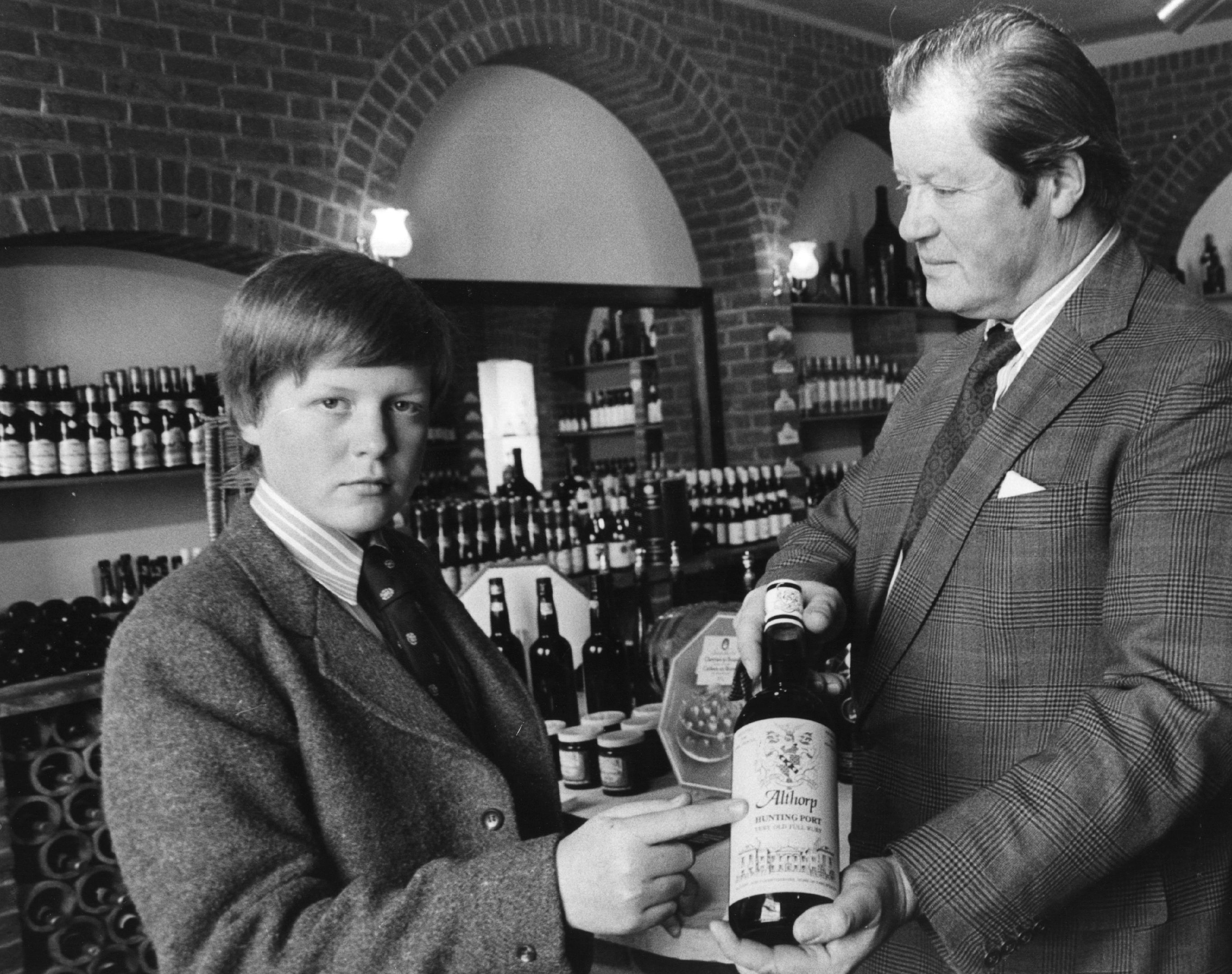 Charles Spencer, Viscount Althorp with his father the 8th Earl Spencer in their cellar at Althorp House in on September 9, 1977 in Northamptonshire. / Source: Getty Images