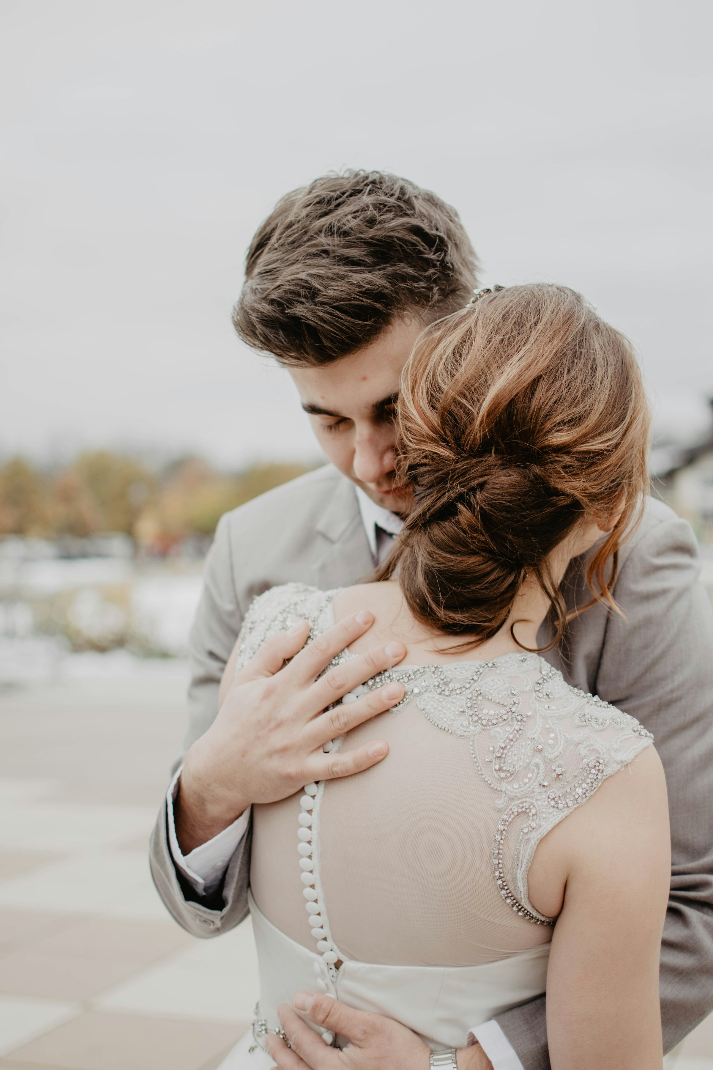 A newlywed couple embracing each other | Source: Unsplash