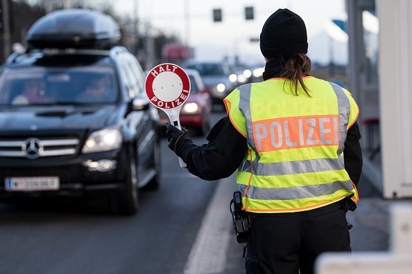 A policewoman controlling traffic on a busy road | Photo: Getty Images