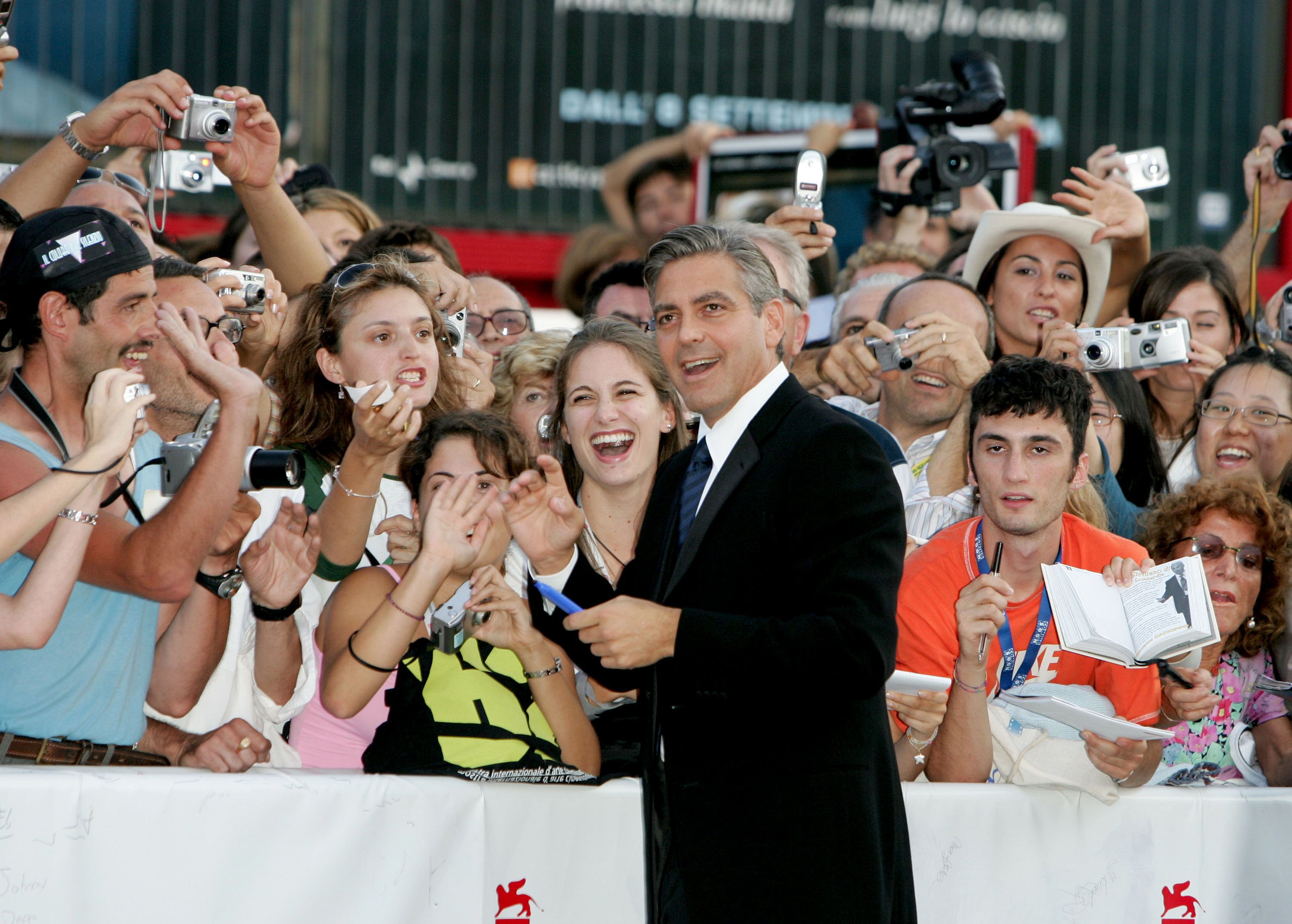 George Clooney with fans at the Closing Ceremony Red Carpet event during the 2005 Venice Film Festival. | Source: Getty Images