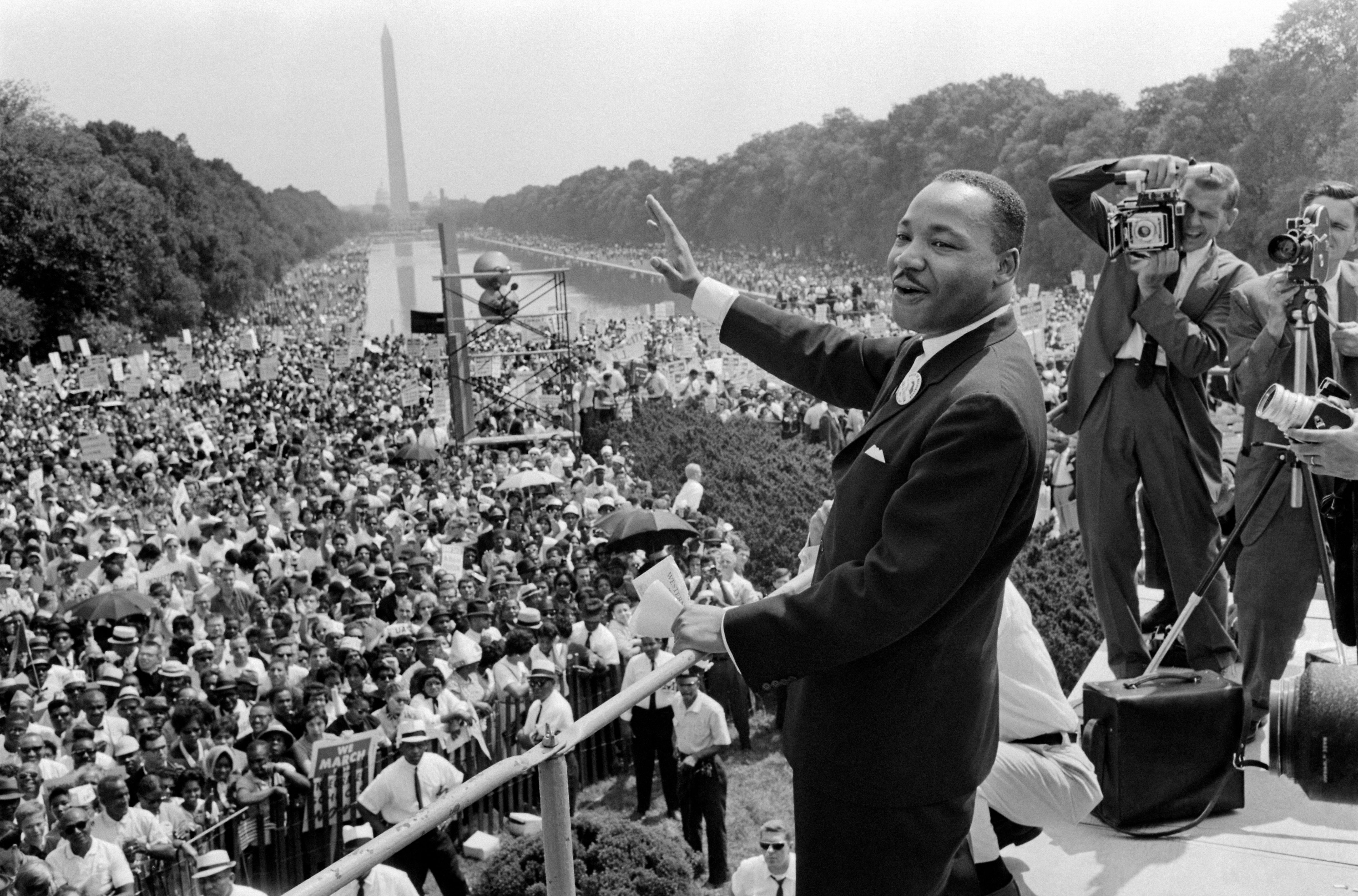 US civil rights leader Martin Luther King (C) waves to supporters on August 28, 1963, on the Mall in Washington D.C. | Source: Getty Images