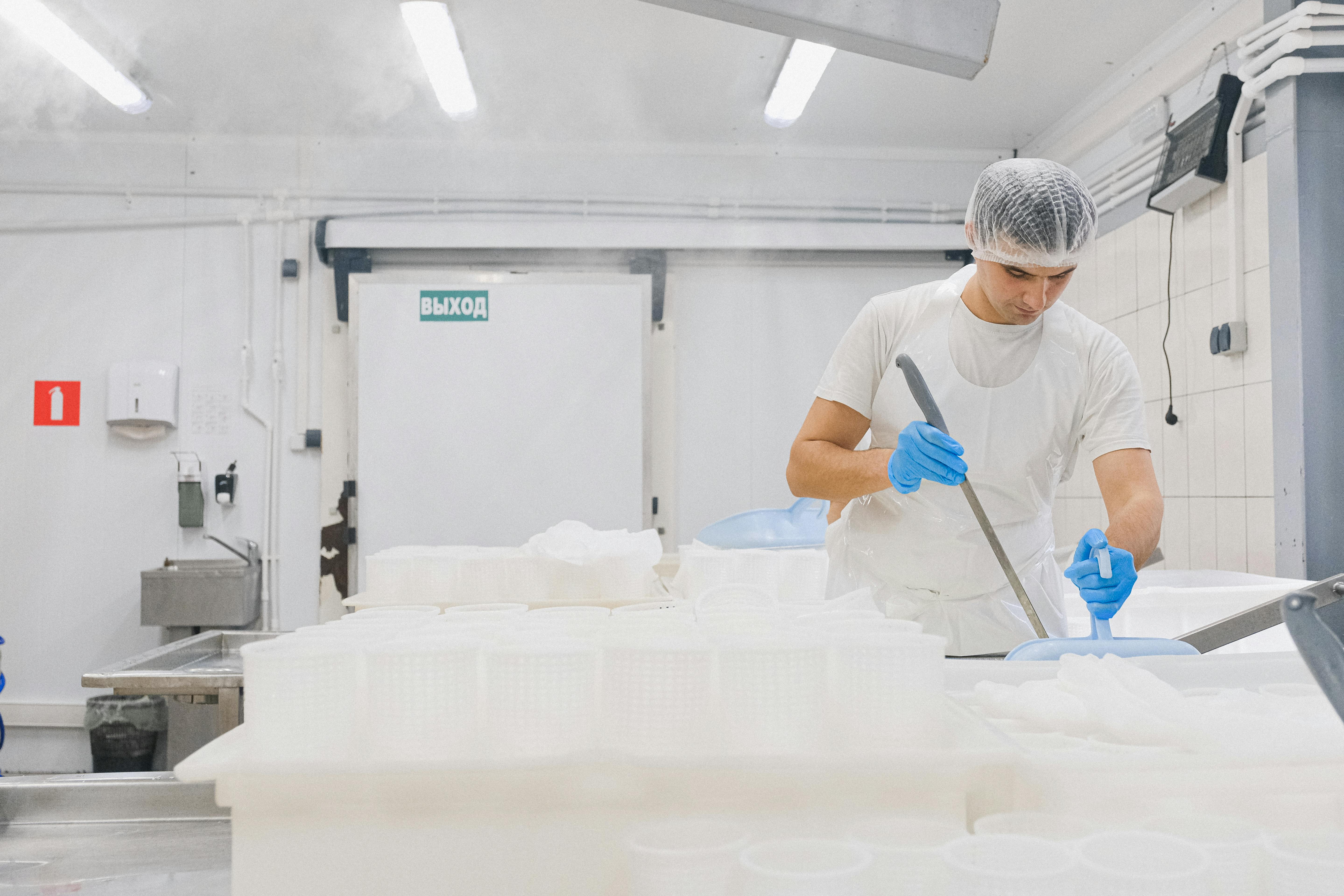 A man working at a cheese factory | Source: Pexels