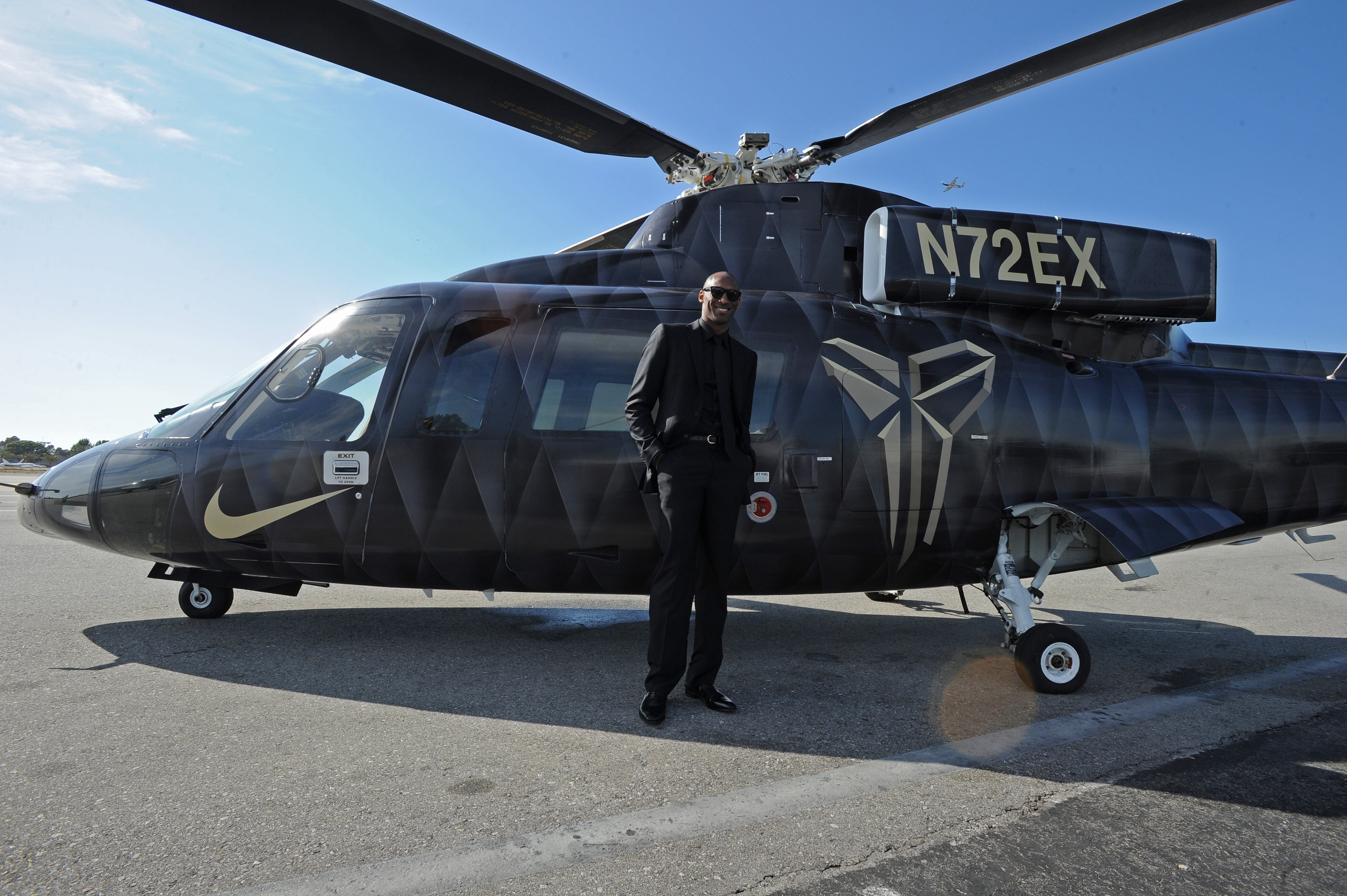 Kobe Bryant #24 of the Los Angeles Lakers poses for a photo in front of the helicopter he took to his last game against the Utah Jazz on April 13, 2016, at Staples Center in Los Angeles, California. | Source: Getty Images.