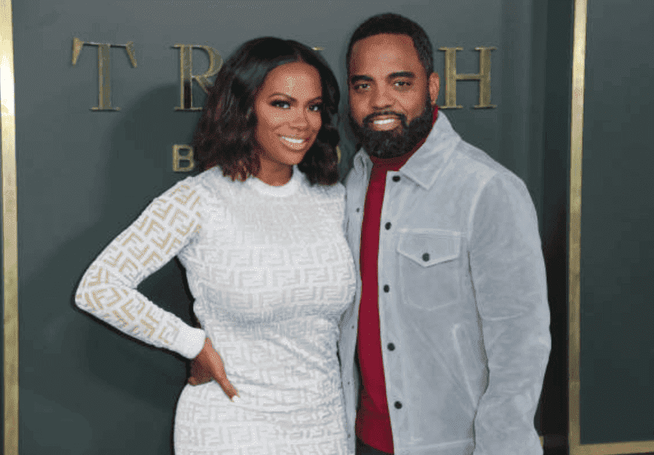 Kandi Burruss and her husband, Todd Tucker pose on the red carpet at the Premiere for "Truth Be Told," at AMPAS Samuel Goldwyn Theater, on November 11, 2019, California | Source: Getty Images (Photo by Leon Bennett/FilmMagic)