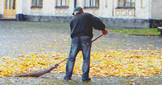 An old man sweeping a yard | Source: Shutterstock