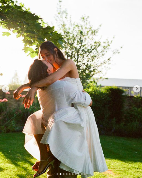 Jesse Bongiovi and Jesse Light sharing a tender moment during their five-day wedding celebration posted on July 15, 2024 | Source: Instagram/alison_events