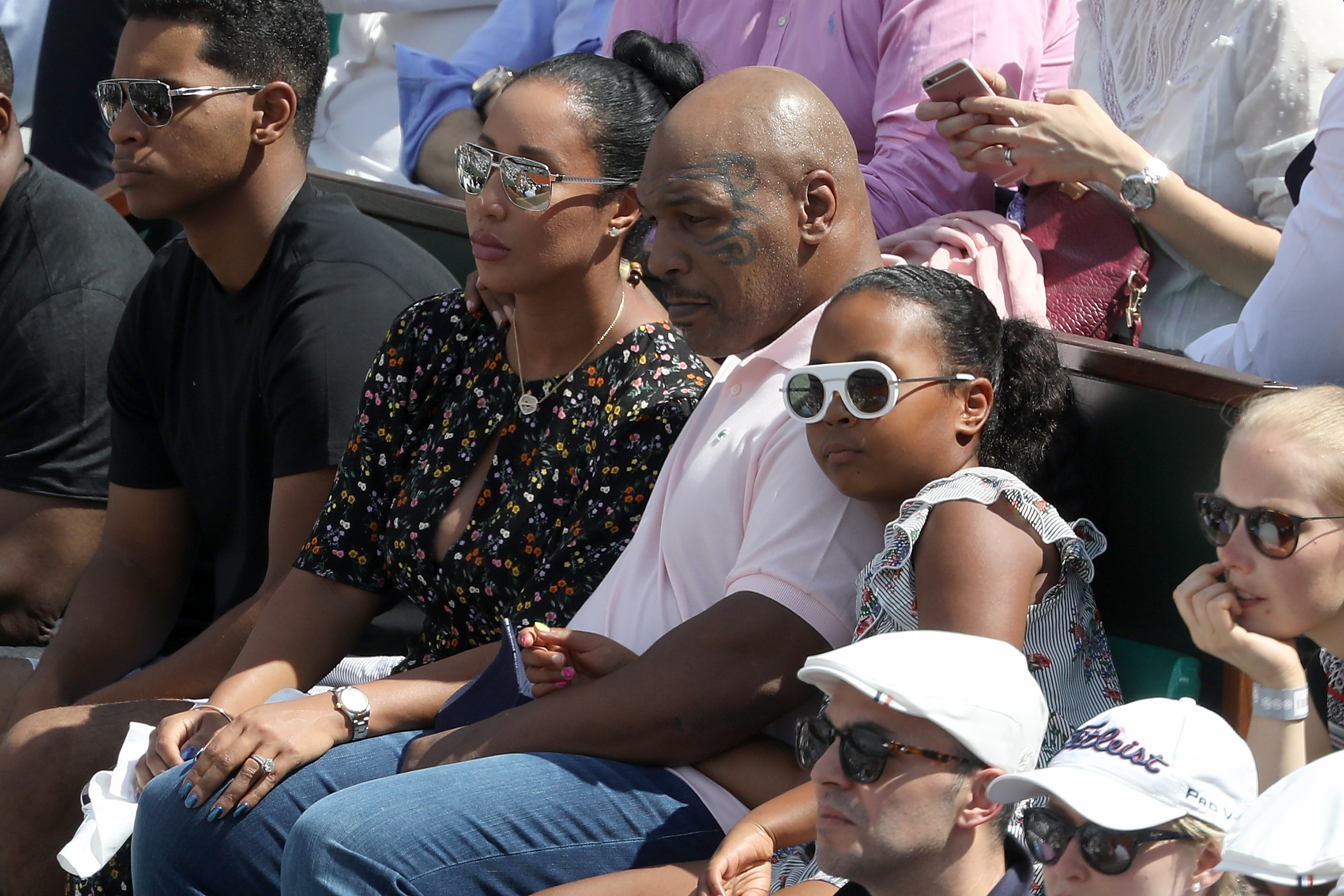 Mike Tyson, accompanied by his daughter Milan and his wife Lakiha, at the 2018 French Open - Day Twelve at Roland Garros on June 7, 2018, in Paris, France | Source: Getty Images