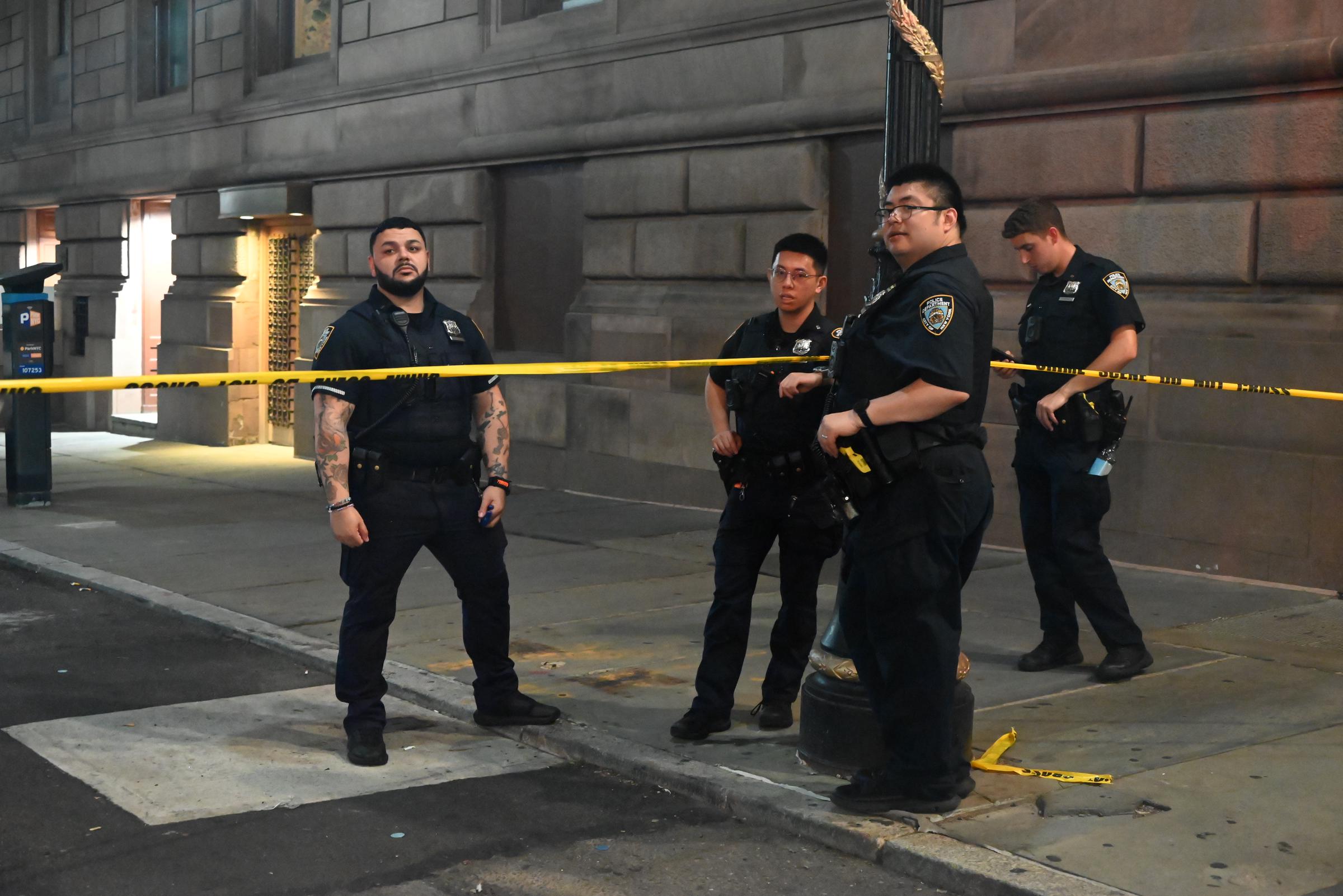 Law enforcement officers including the FBI work at the scene where NYPD police officer Didarul Islam was killed in a mass shooting attack at 345 Park Avenue in New York City, on July 28, 2025 | Source: Getty Images
