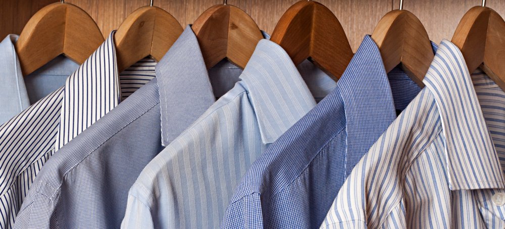 Shirts placed on hangers. | Photo: Shutterstock