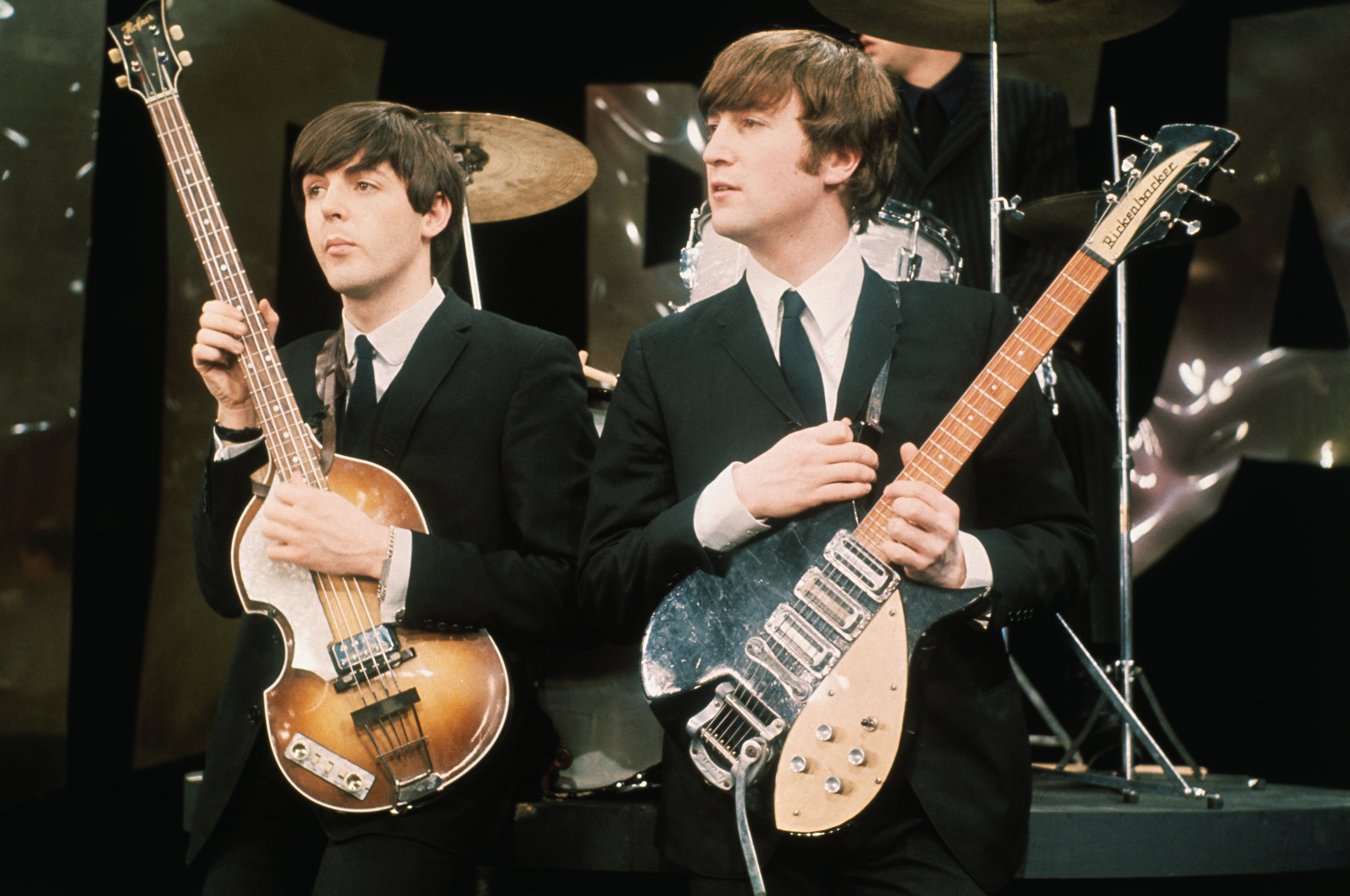 Paul McCartney and John Lennon on the "The Ed Sullivan Show" set in Manhattan | Source: Getty Images