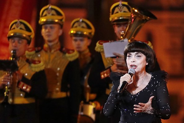  French singer Mireille Mathieu performs during the closing ceremony of the 12th Spasskaya Tower International Military Music Festival in Red Square. Artyom Geodakyan/TASS (Photo by Artyom Geodakyan\TASS via Getty Images)