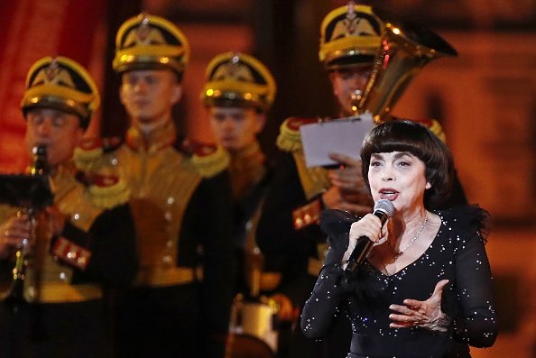 French singer Mireille Mathieu performs during the closing ceremony of the 12th Spasskaya Tower International Military Music Festival in Red Square. Artyom Geodakyan/TASS (Photo by Artyom Geodakyan\TASS via Getty Images)