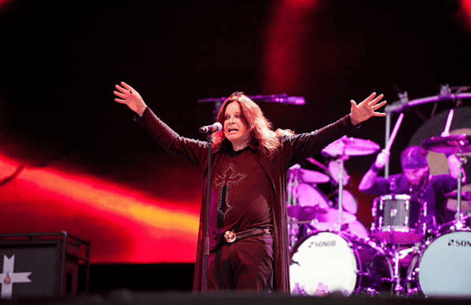 Ozzy Osbourne stand in front of a mic as he performs live onstage at the Download Festival, June 10, 2012, in Donington Park | Source: Getty Images