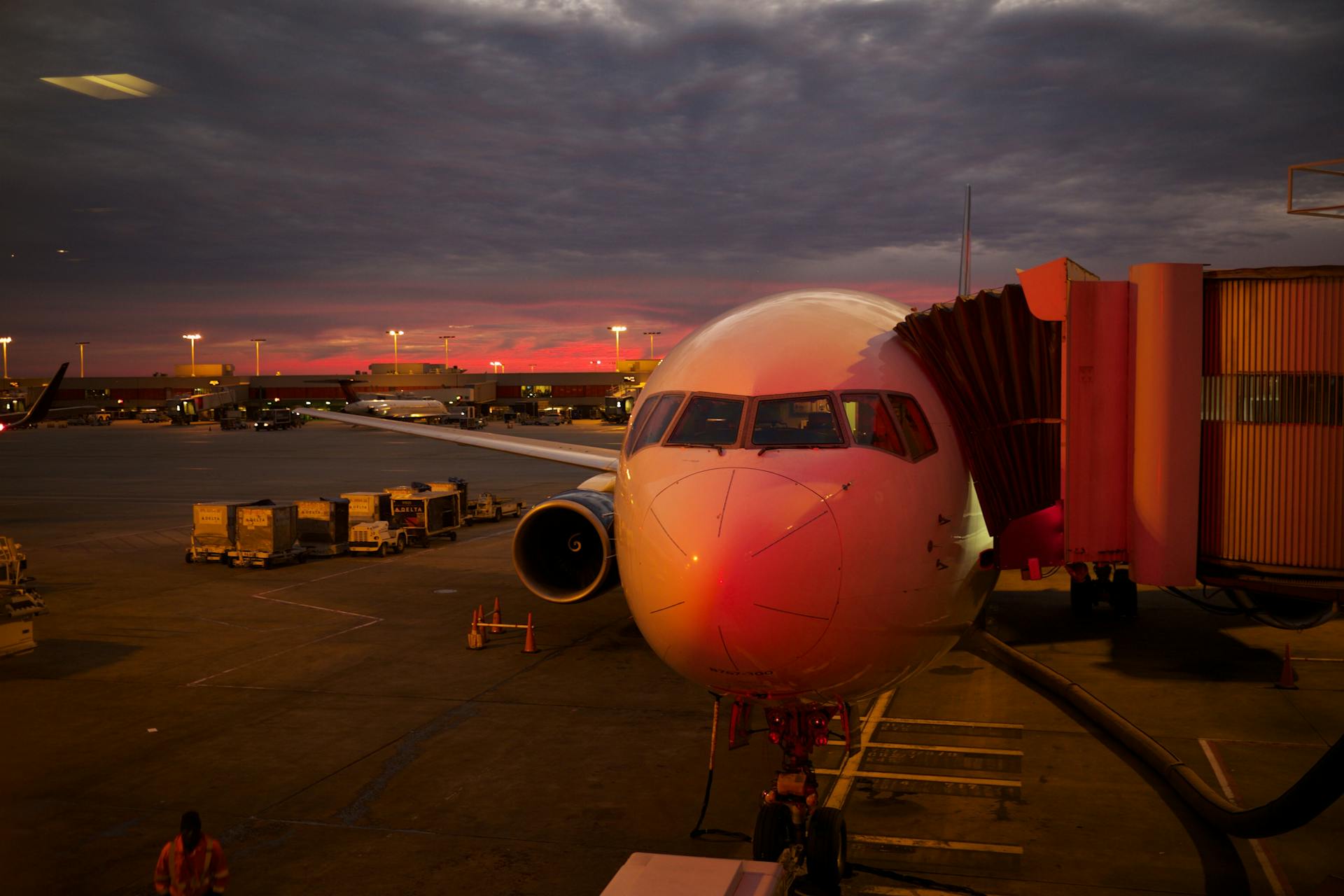 An airplane parked at the airport at night | Source: Pexels