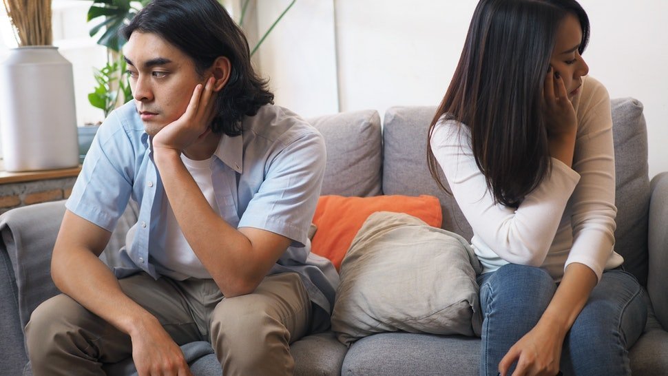 A man and a woman having an argument in their living room | Photo: Shutterstock