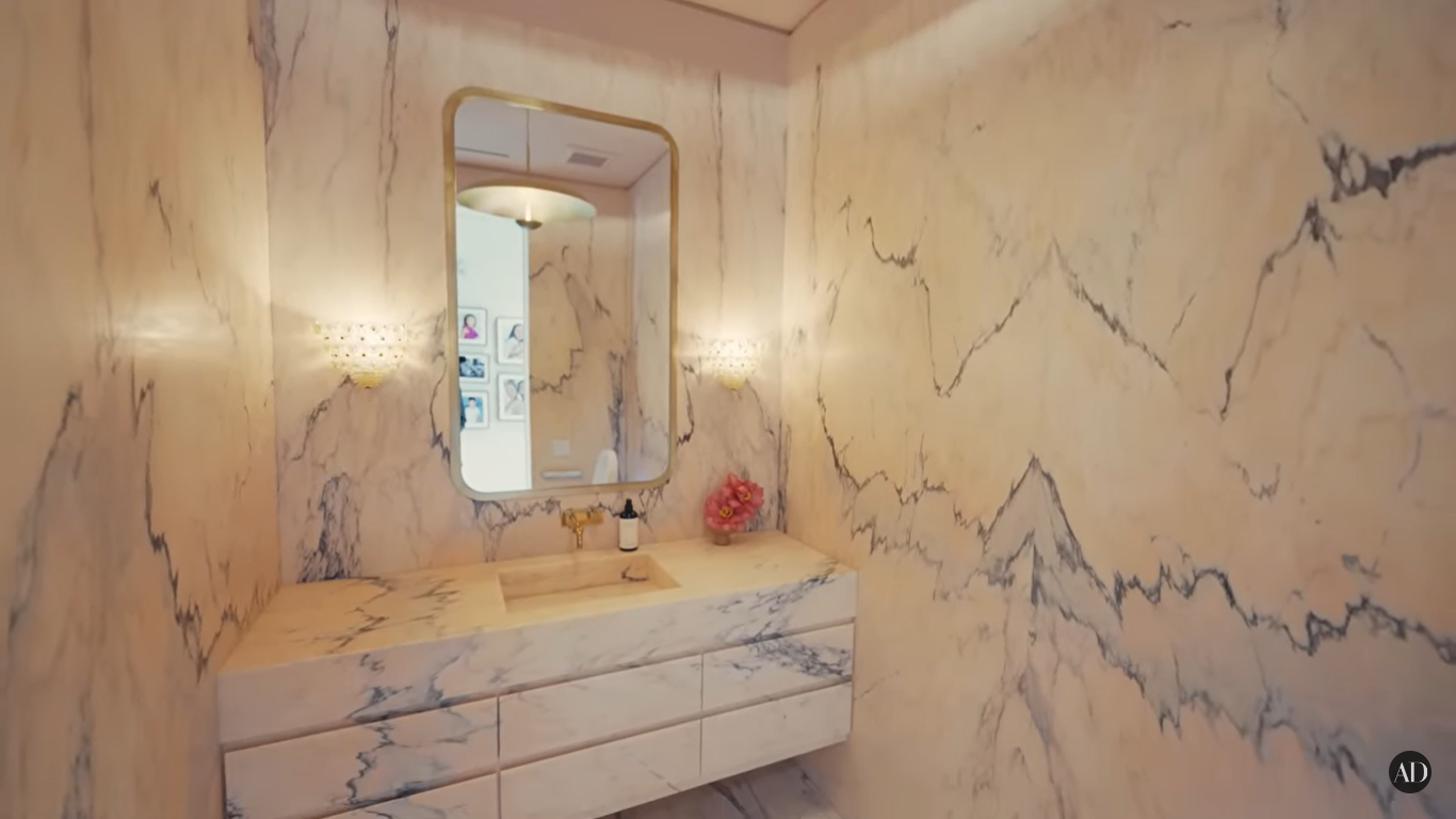 Chrissy Teigen and John Legend's powder room at their Beverly Hills home | Source: YouTube/ArchitecturalDigest