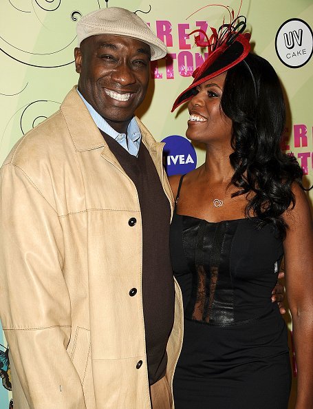 Actor Michael Clarke Duncan and Omarosa Manigault-Stallworth attend Perez Hilton's Mad Hatter tea party birthday celebration on March 24, 2012 in Los Angeles, California | Photo: Getty Images