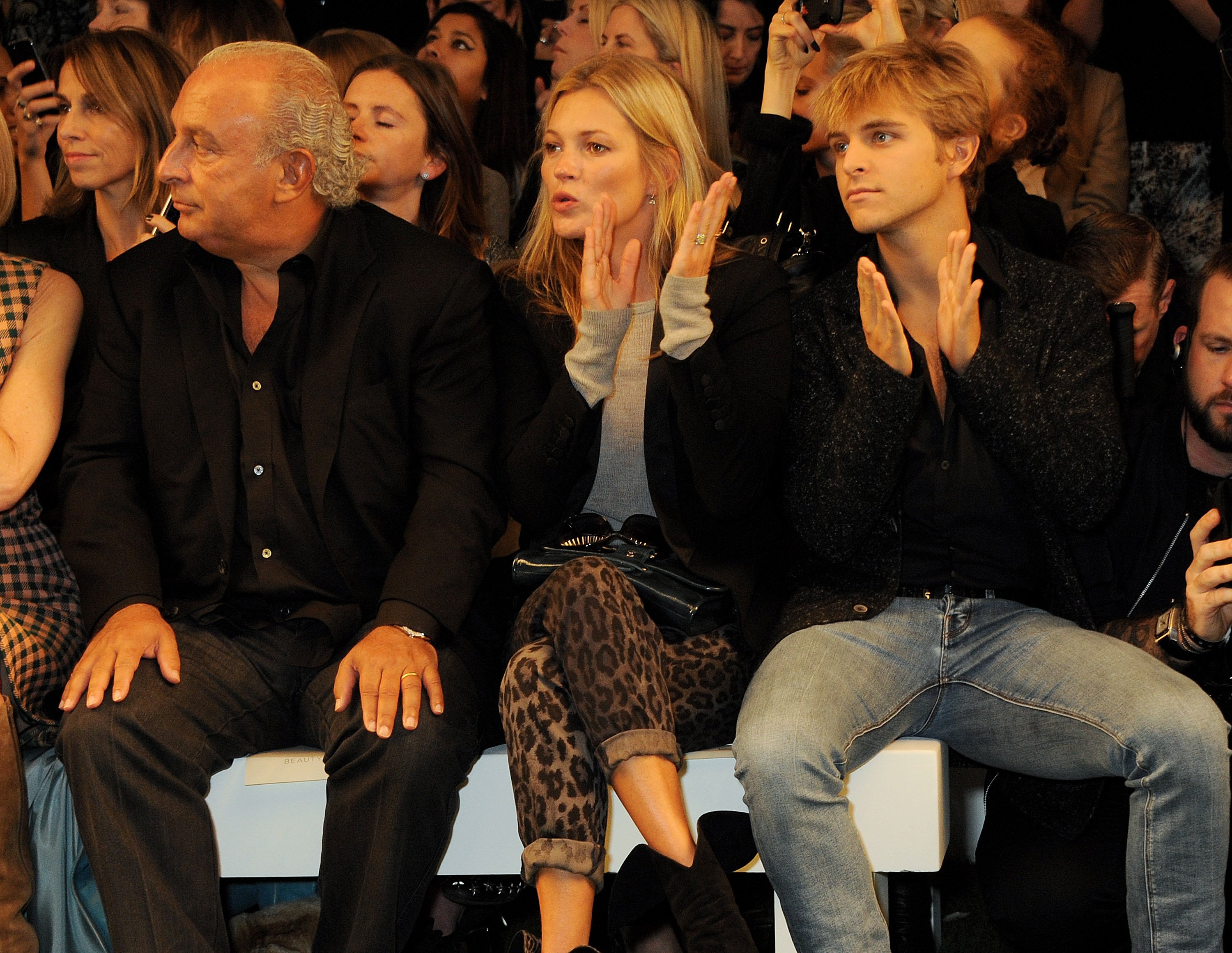 Sir Philip Green, Kate Moss, and Brandon Green at London Fashion Week on September 15, 2013 | Source: Getty Images