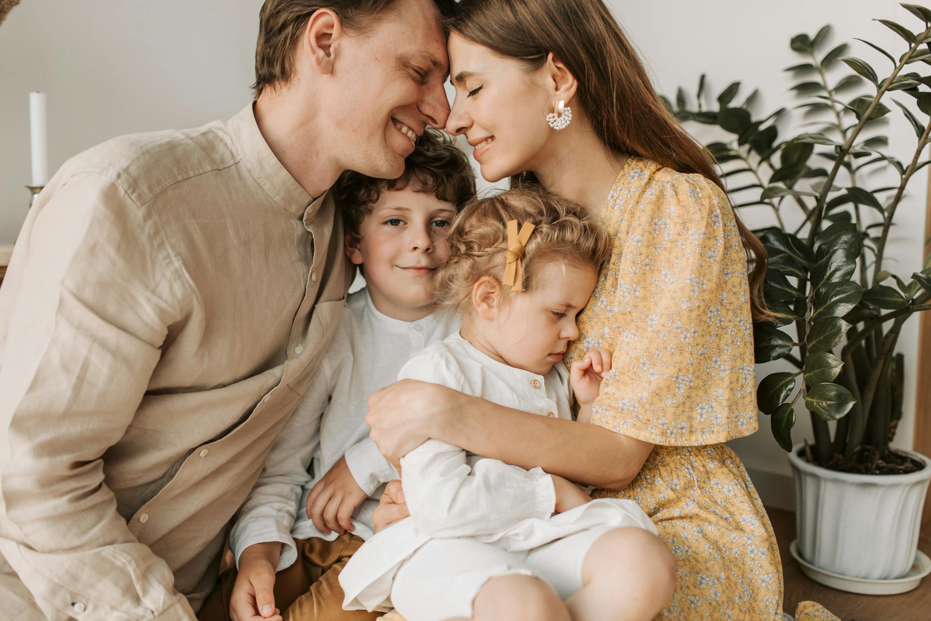 A loving couple with their two kids | Source: Pexels