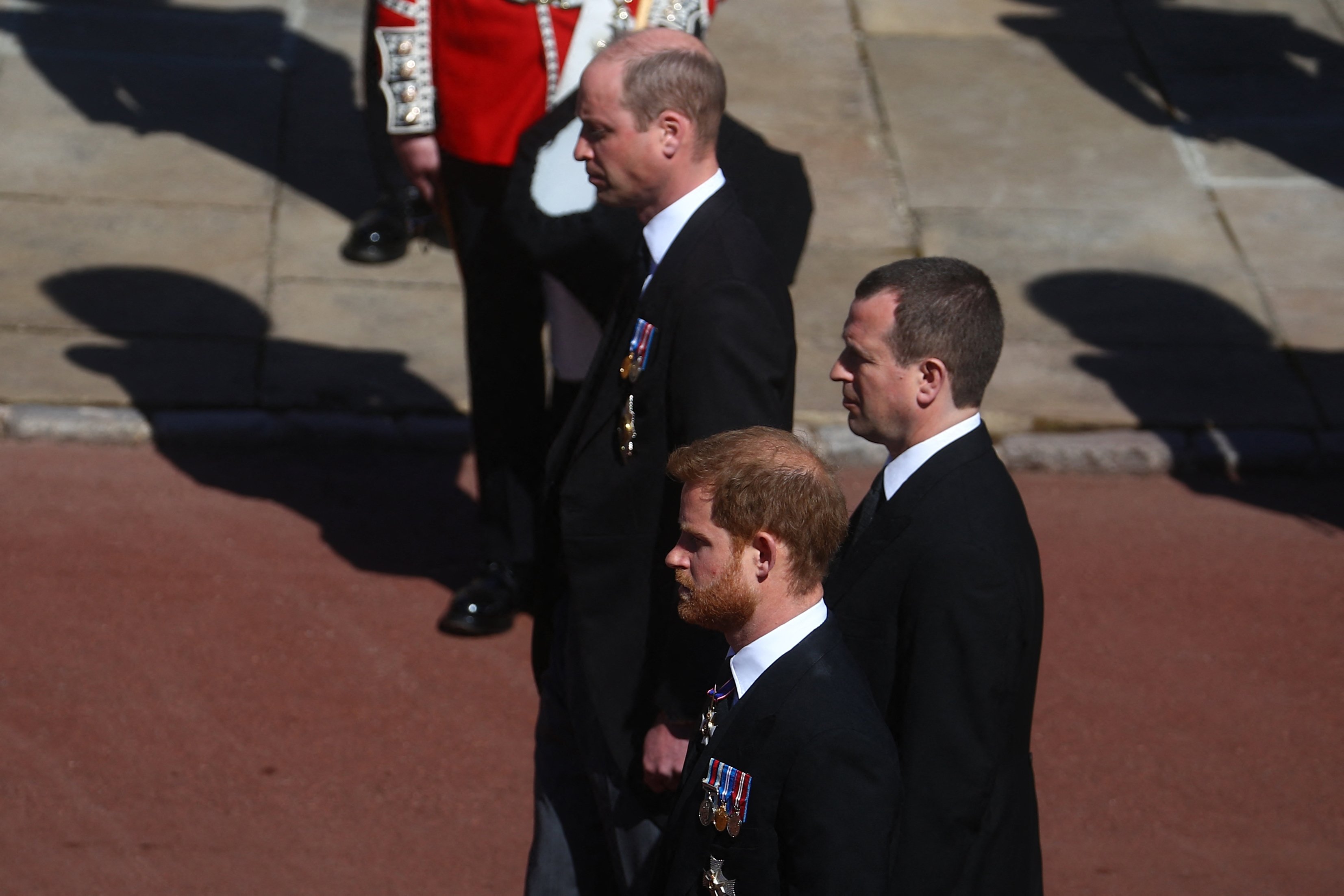 Prince William, Prince Harry and their cousin Peter Phillips follow the coffin of their grandfather, Prince Philip, the Duke of Edinburgh on April, 17, 2021