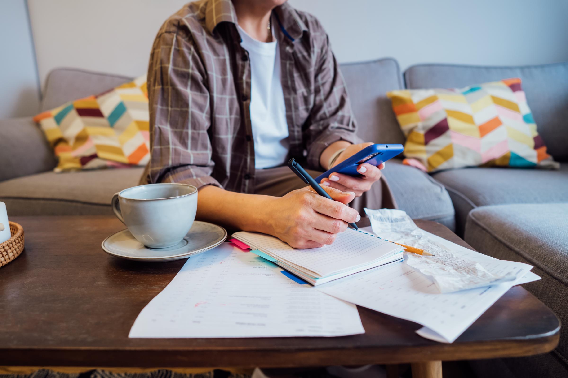 Woman managing expenses | Source: Shutterstock