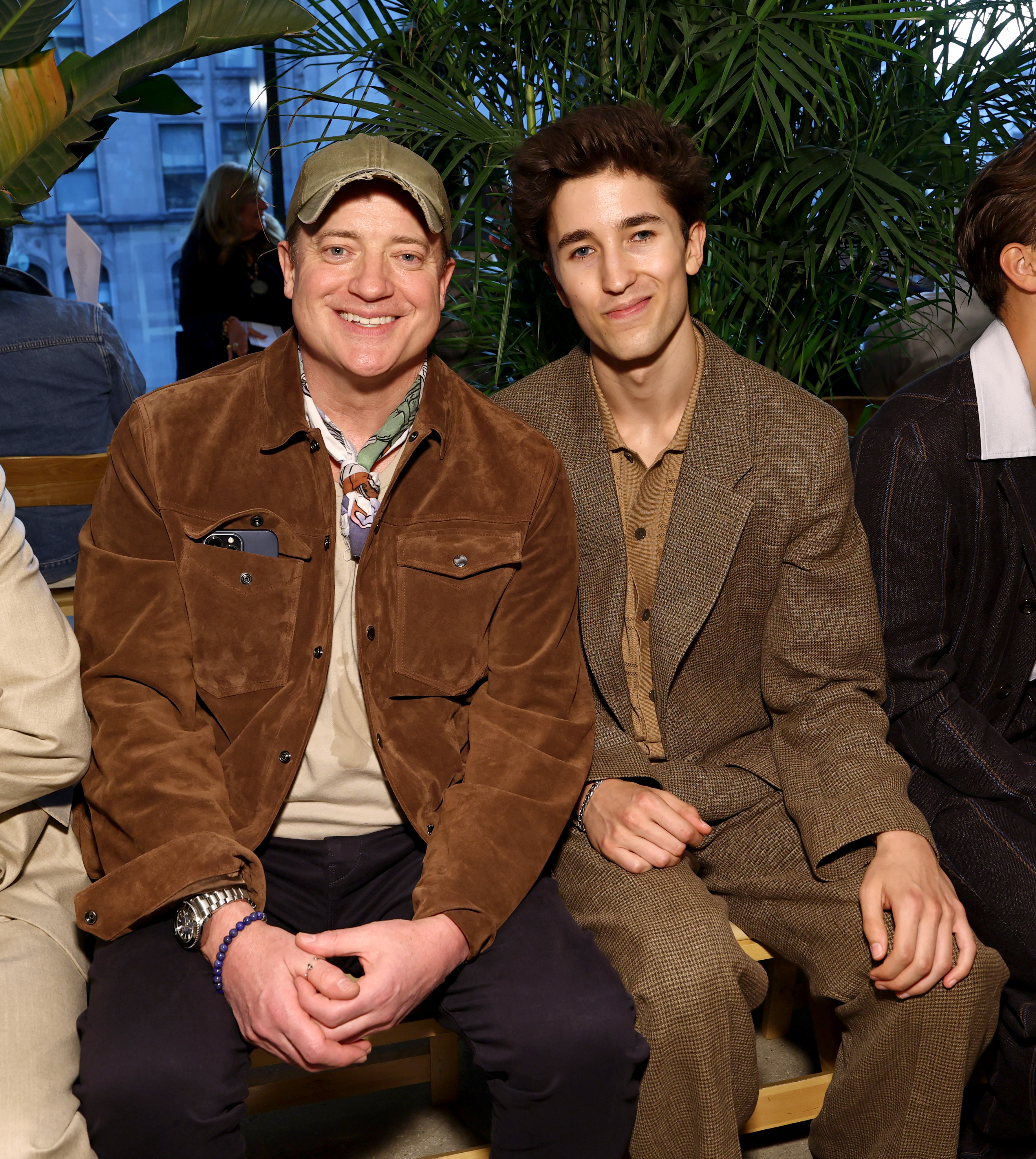 Brendan Fraser smiles beside Griffin Fraser at the Todd Snyder fashion show during September 2025 New York Fashion Week in New York City.