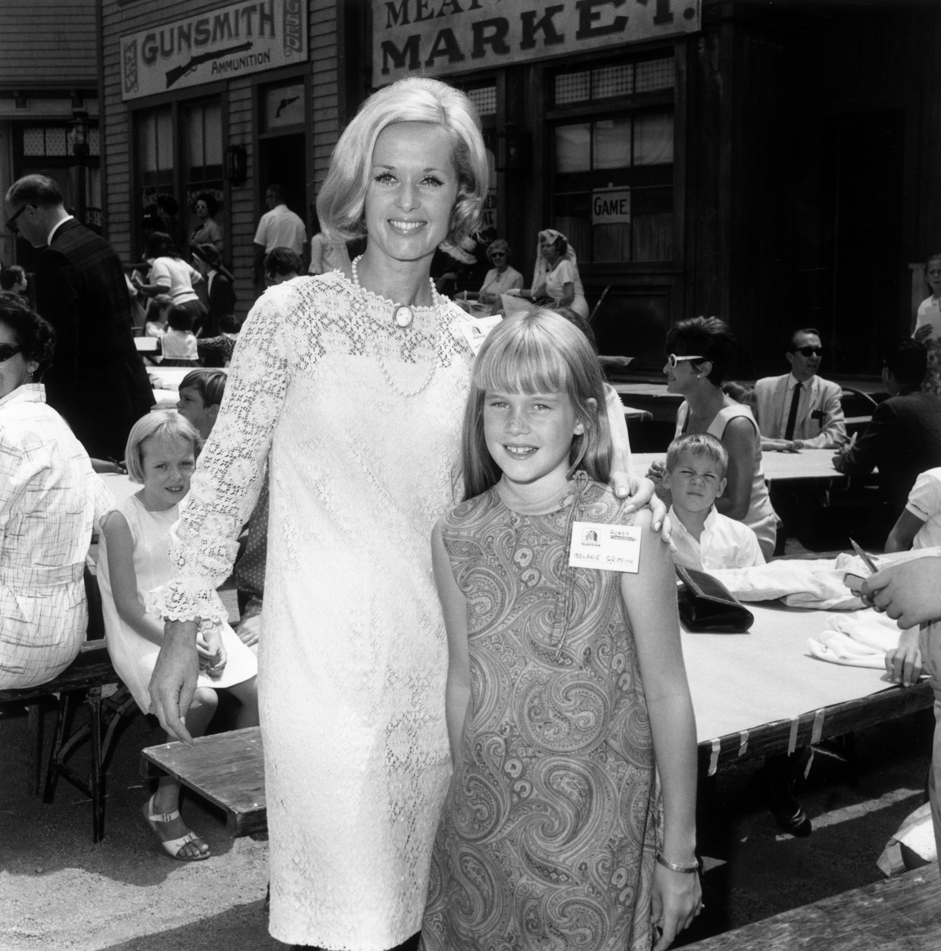 Tippi Hedren and her daughter, Melanie Griffith, at a children's party, a 'Batman' luncheon for an orphanage in California | Source: Getty Images