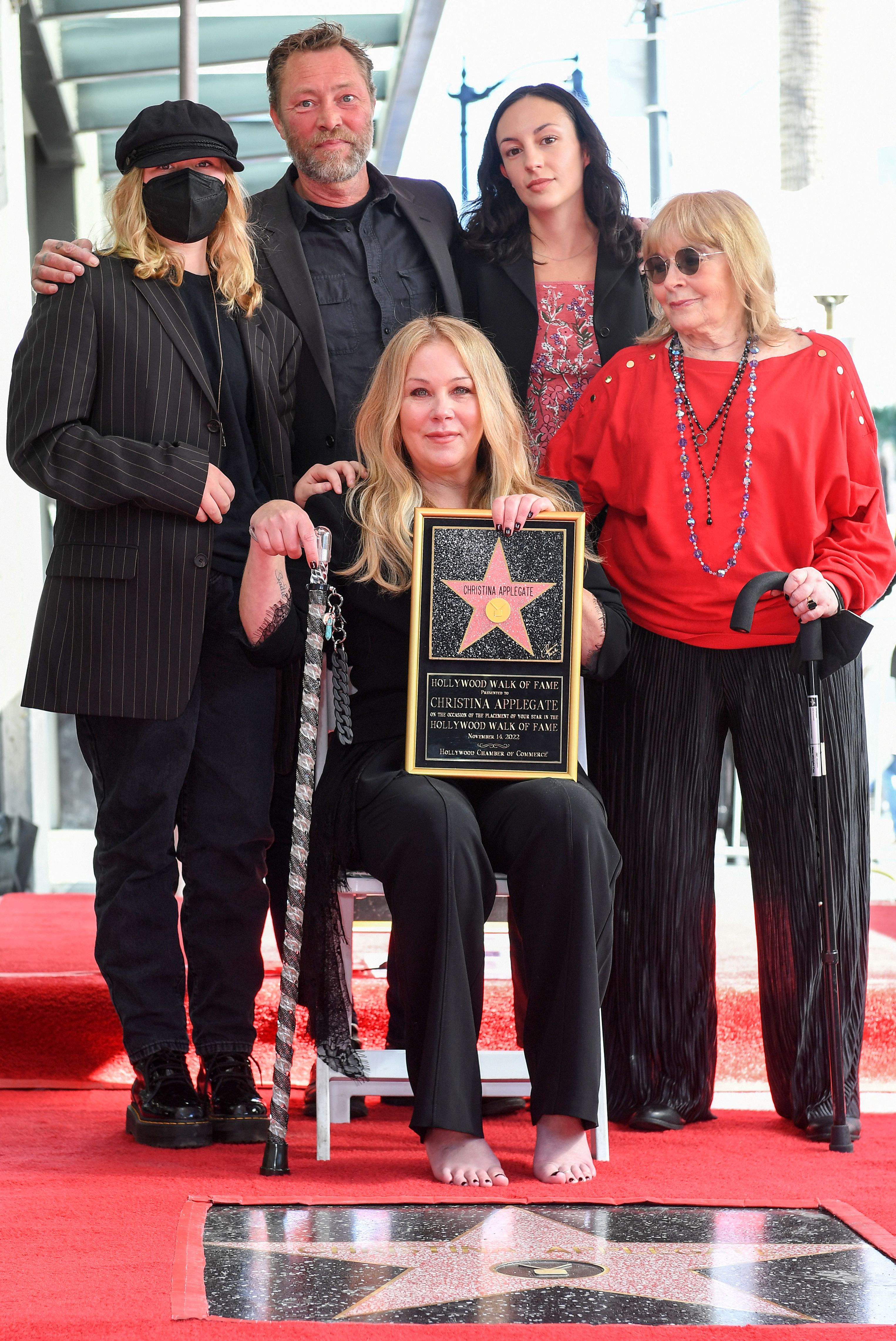 Sadie Grace LeNoble, Martyn LeNoble, Christina Applegate, guest, and Nancy Priddy pose with Christina Applegate's star during the Hollywood Walk of Fame Ceremony in Los Angeles, California, on November 14, 2022. | Source: Getty Images