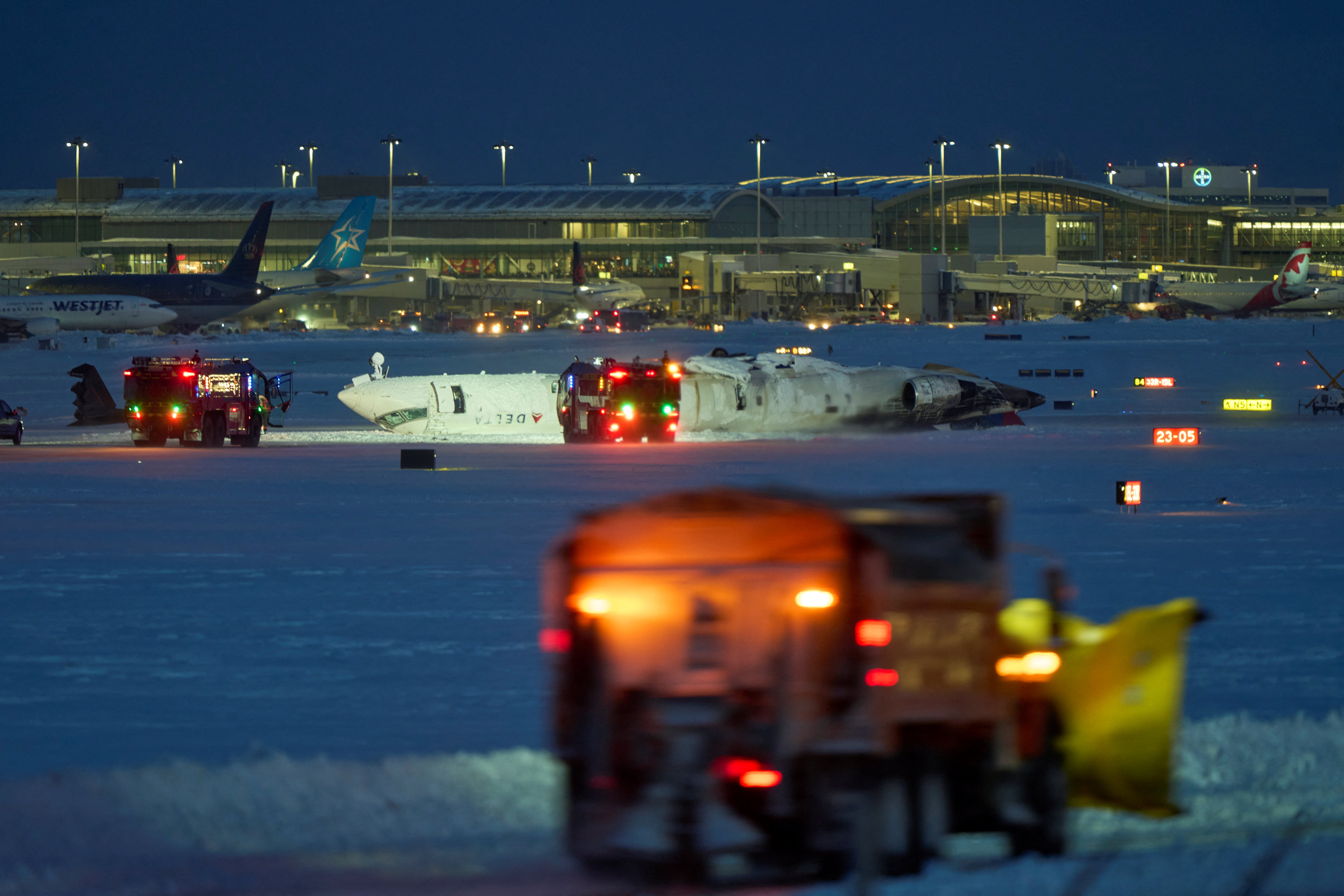 A Delta airlines plane is seen after crashing upon landing at Toronto Pearson Airport in Toronto, Ontario, on February 17, 2025 | Source: Getty Images