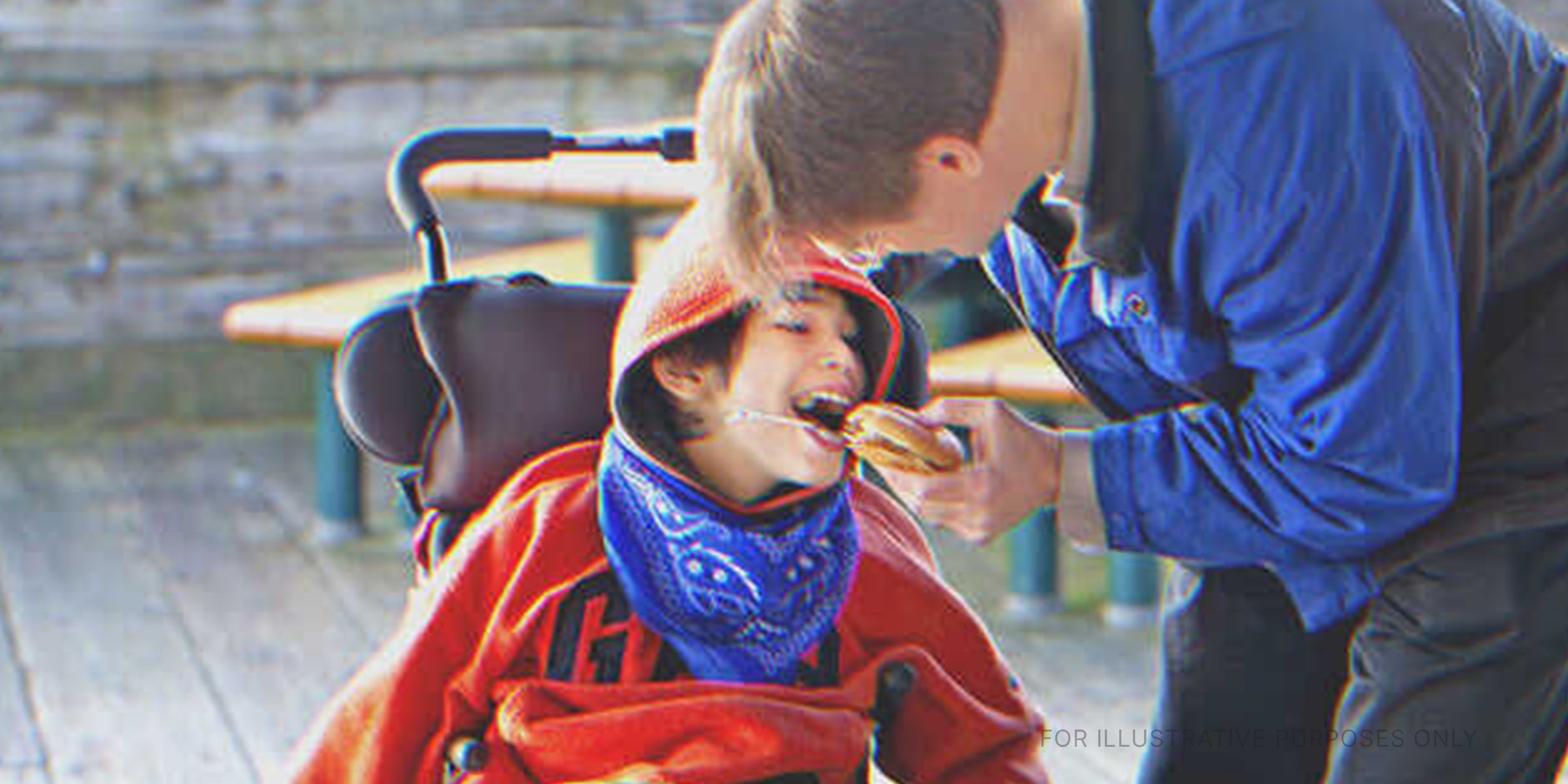 A father feeding his son | Source: Getty Images