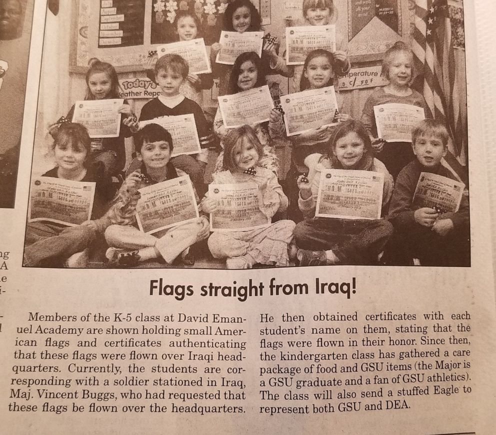 A photo of the David Emmanuel Academy kindergarten kids holding up their flags General Vincent Buggs gave them made it to their local newspaper. | Source: Facebook/davidemmanuelacademy| 