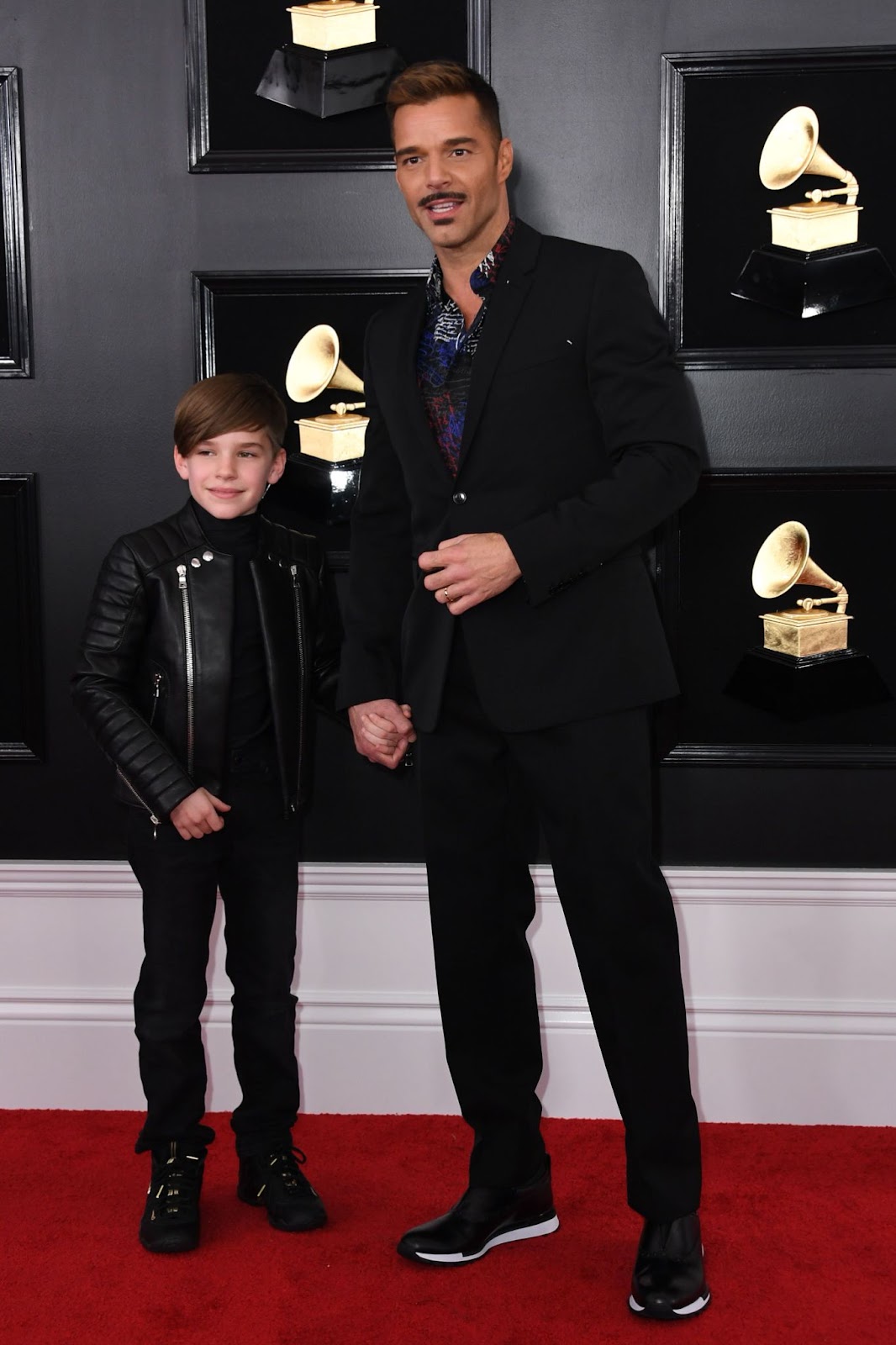 Ricky Martin attended the 61st Annual Grammy Awards on February 10, 2019, in Los Angeles, with one of his twin sons by his side. The father-son duo showcased a stylish bond on the red carpet, hinting at the close relationship that continues to grow as his boys mature. | Source: Getty Images