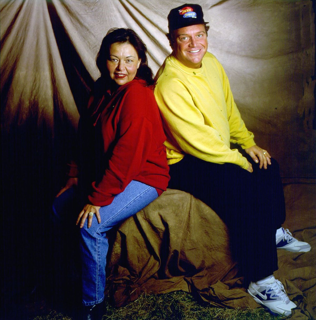 Portrait of actors Roseanne Barr and Tom Arnold backstage at Farm Aid, in Ames, Iowa, on March 14, 1992. | Source: Getty Images
