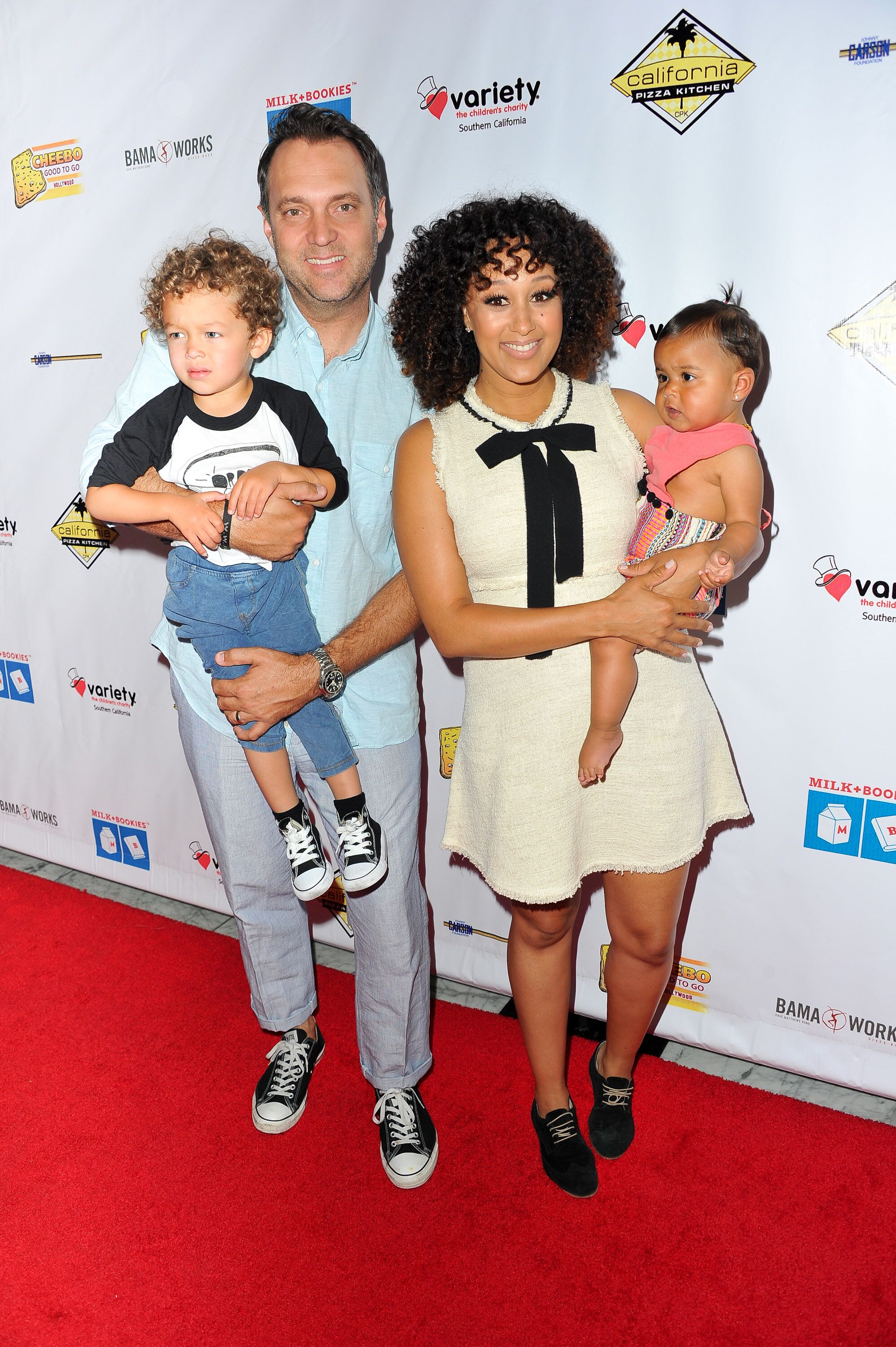 Tamera Mowry and Adam Housley with their children at the Milk + Bookies 7th Annual Story Time Celebration/ Source: Getty Image