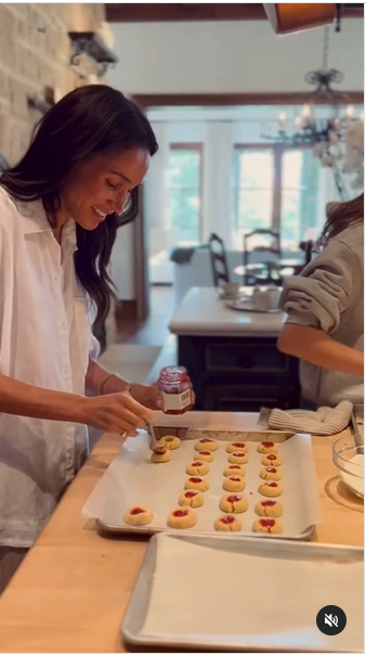 Meghan Markle putting jam on her cookies. | Source: Instagram/meghan