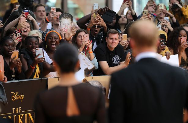 Fans reacting to seeing Duchess Meghan and Prince Harry at The Lion King premiere in London on July 14, 2019 | Photo: Getty Images